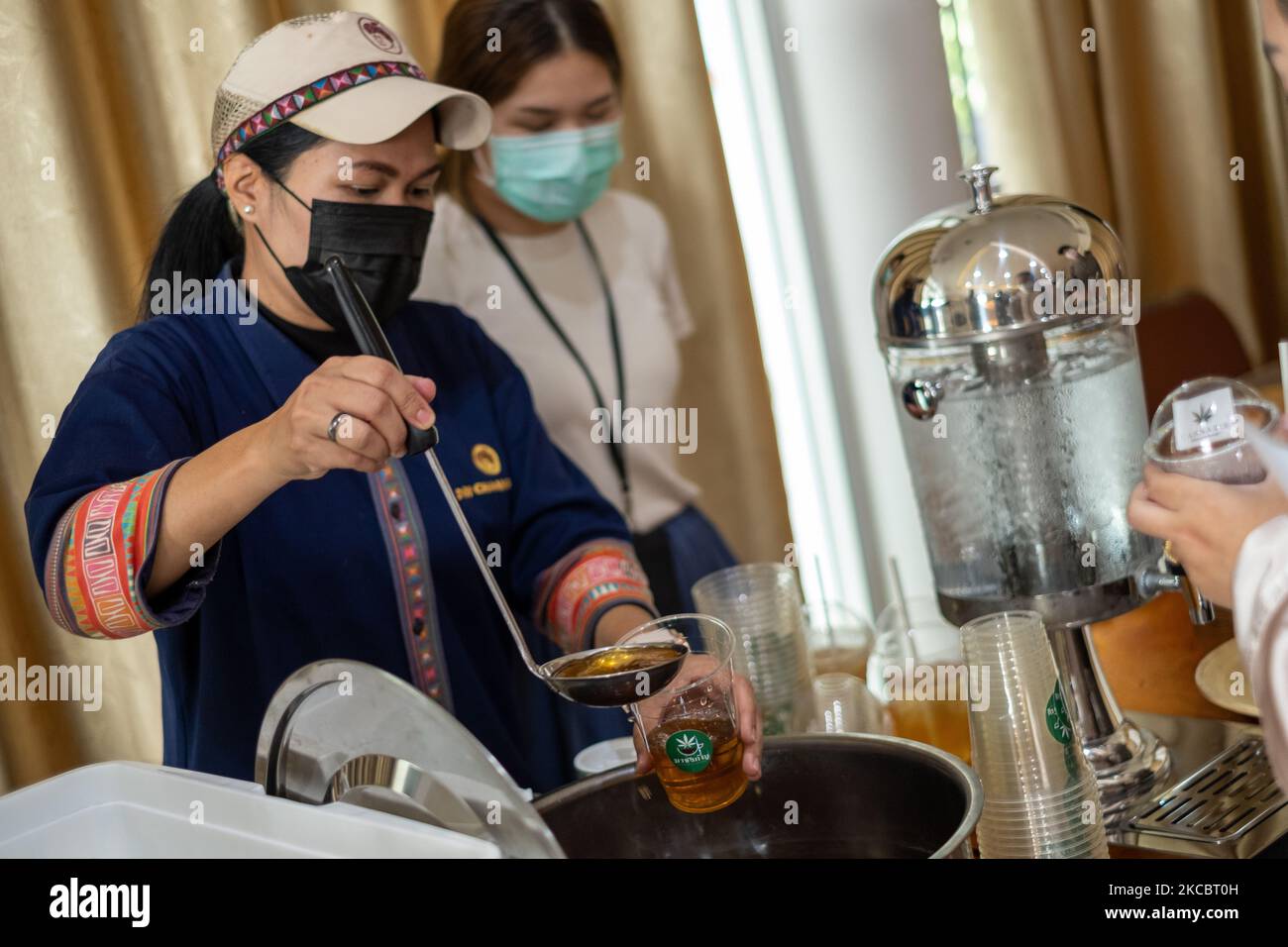 Thai chef prepares a infuse use cannabis extract on March 26, 2021 in Bangkok, Thailand. Cannabis and its derivates can now be used in food and drinks provided they meet Thai FDA regulations. Thailand is moving to legalize cannabis and its derivates in the hope of becoming a global hub for medical marijuana. The government is now those who apply to grow the crop, provided they comply with FDA regulations. (Photo by Thomas De Cian/NurPhoto) Stock Photo