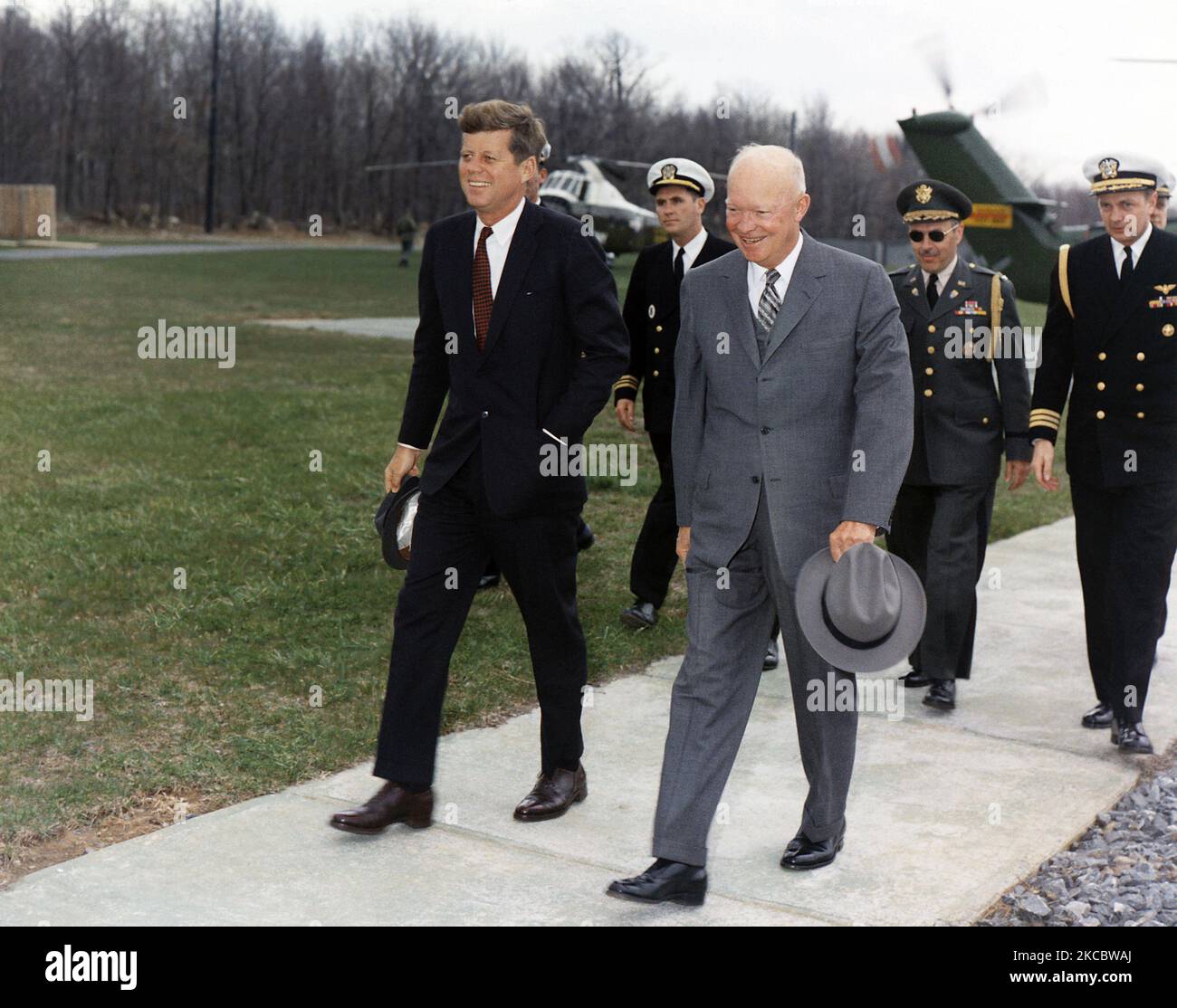 President John F. Kennedy and former President Dwight Eisenhower meeting at Camp David. Stock Photo