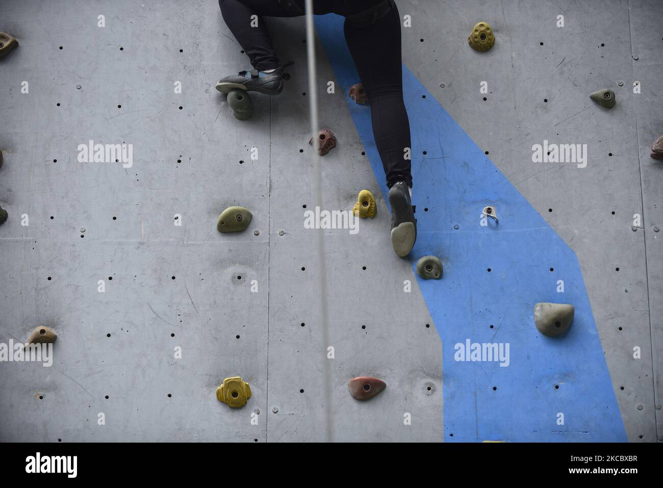 A visually impaired girl tries to climb wall in Astrek Climbing wall at