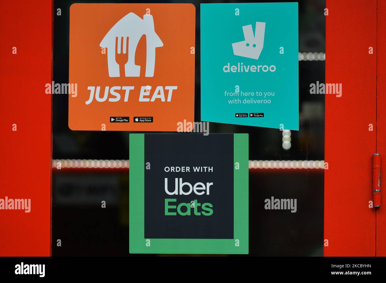 Deliveroo, Just Eat and Uber Eats stickers seen in a restaurant window in Dublin city center during Level 5 Covid-19 lockdown. On Thursday, April 1, 2021, in Dublin, Ireland. (Photo by Artur Widak/NurPhoto) Stock Photo