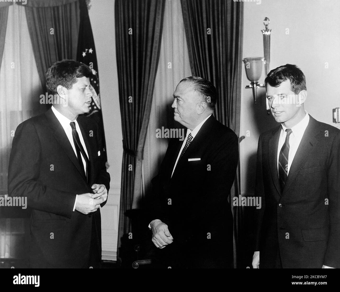 President John F. Kennedy with Robert F. Kennedy and J. Edgar Hoover in the White House, 1961. Stock Photo