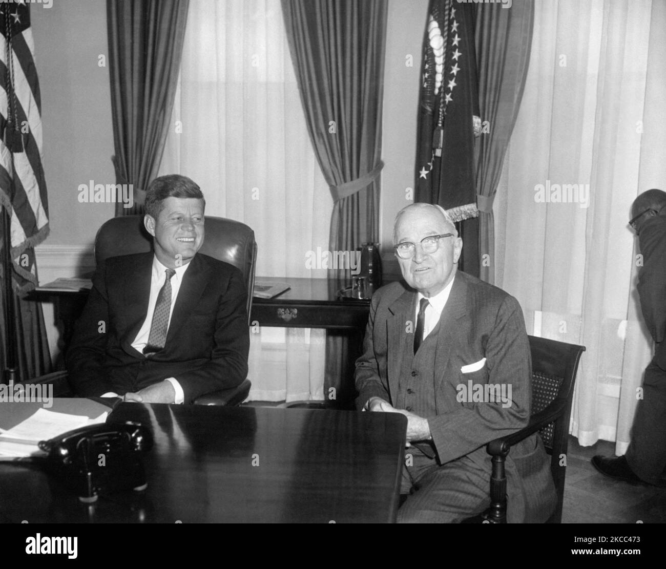 President John F. Kennedy and Harry S. Truman in the Oval Office of the White House. Stock Photo