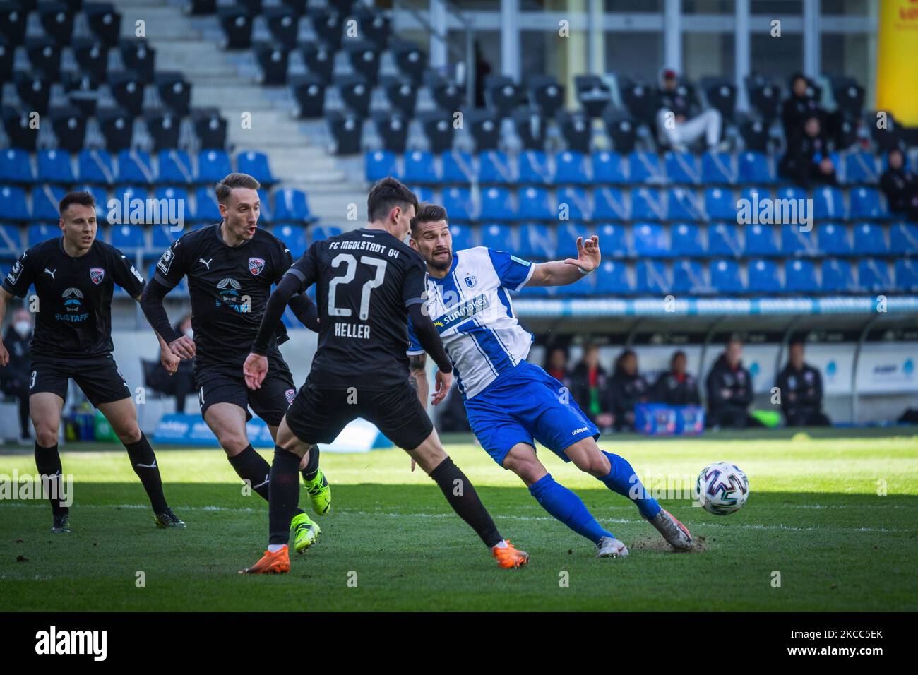 (from left to right) Dominik Franke, Tobias Schroeck and Thomas Keller of Ingolstadt and Kai Bruenker of Magdeburg vie for the ball during the 3. Liga match between 1. FC Magdeburg and FC Ingolstadt 04 at MDCC-Arena on April 03, 2021 in Magdeburg, Germany. (Photo by Peter Niedung/NurPhoto) Stock Photo