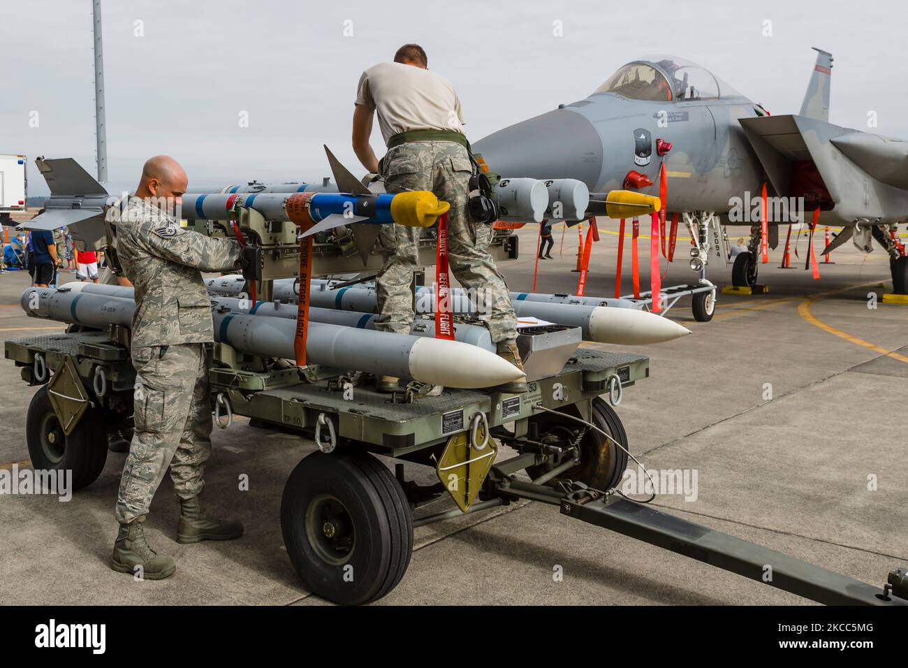 Oregon Air National Guard crews prepare to load missiles on to a F-15C Eagle. Stock Photo