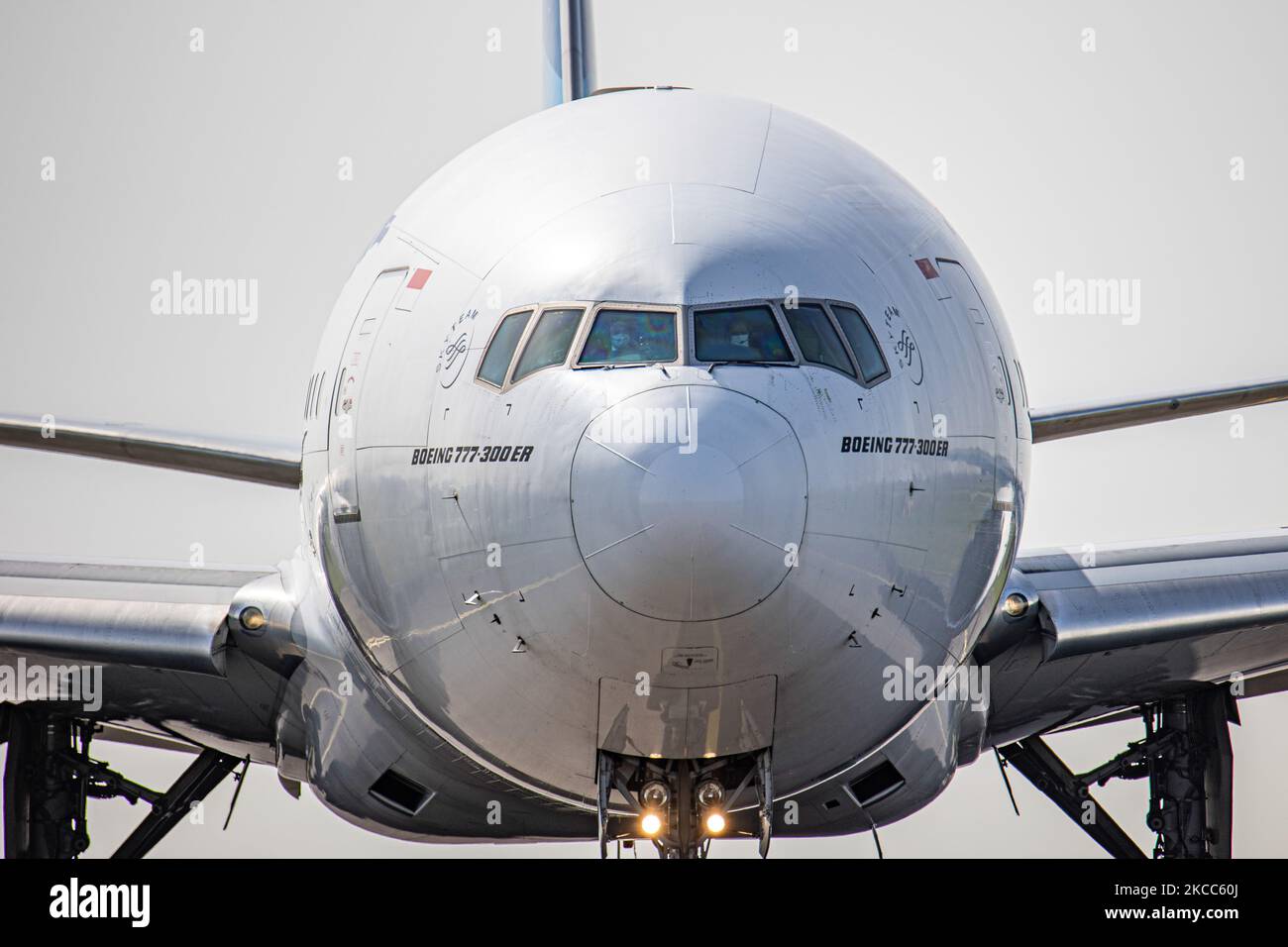 Close up to pilots, captain, first officer and cabin crew are seen ...