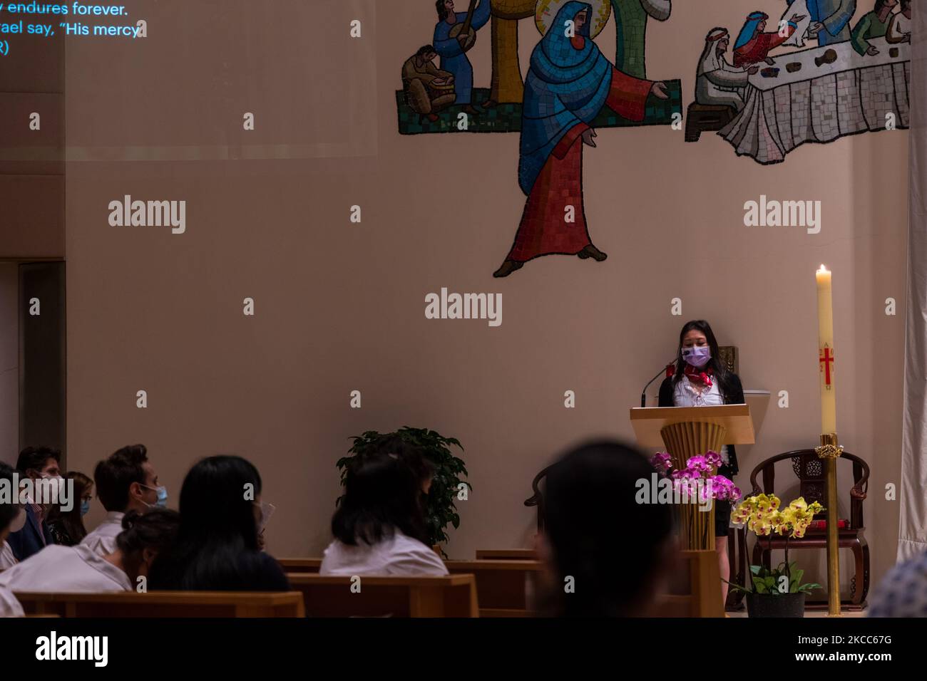 A reading takes place with the Paschal candle lit (the Paschal is lit