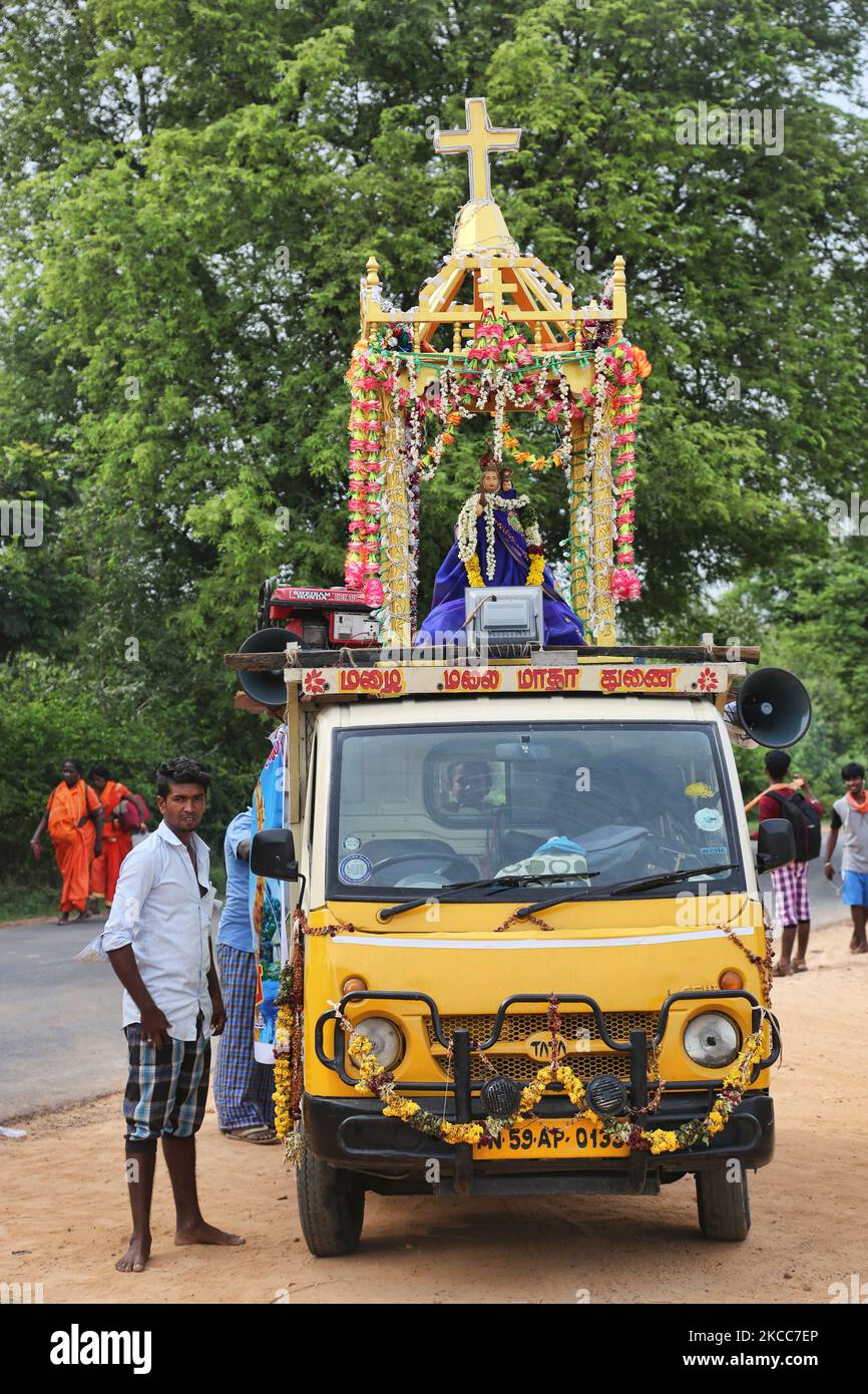 Man stands by a vehicle carrying a statue of the Virgin Mary as thousands of Indian Catholics embark on the pilgrimage and walk to the Annai Velankanni Church (Basilica of Our Lady of Good Health) in Velankanni, Tamil Nadu, India to celebrate the 11-day annual feast of Our Lady of Health, popularly called 'Annai Velankanni Matha' and the 'Lourdes of the East'. The pilgrims walk for 17 days travelling over 20km to reach the church for the annual festival. (Photo by Creative Touch Imaging Ltd./NurPhoto) Stock Photo