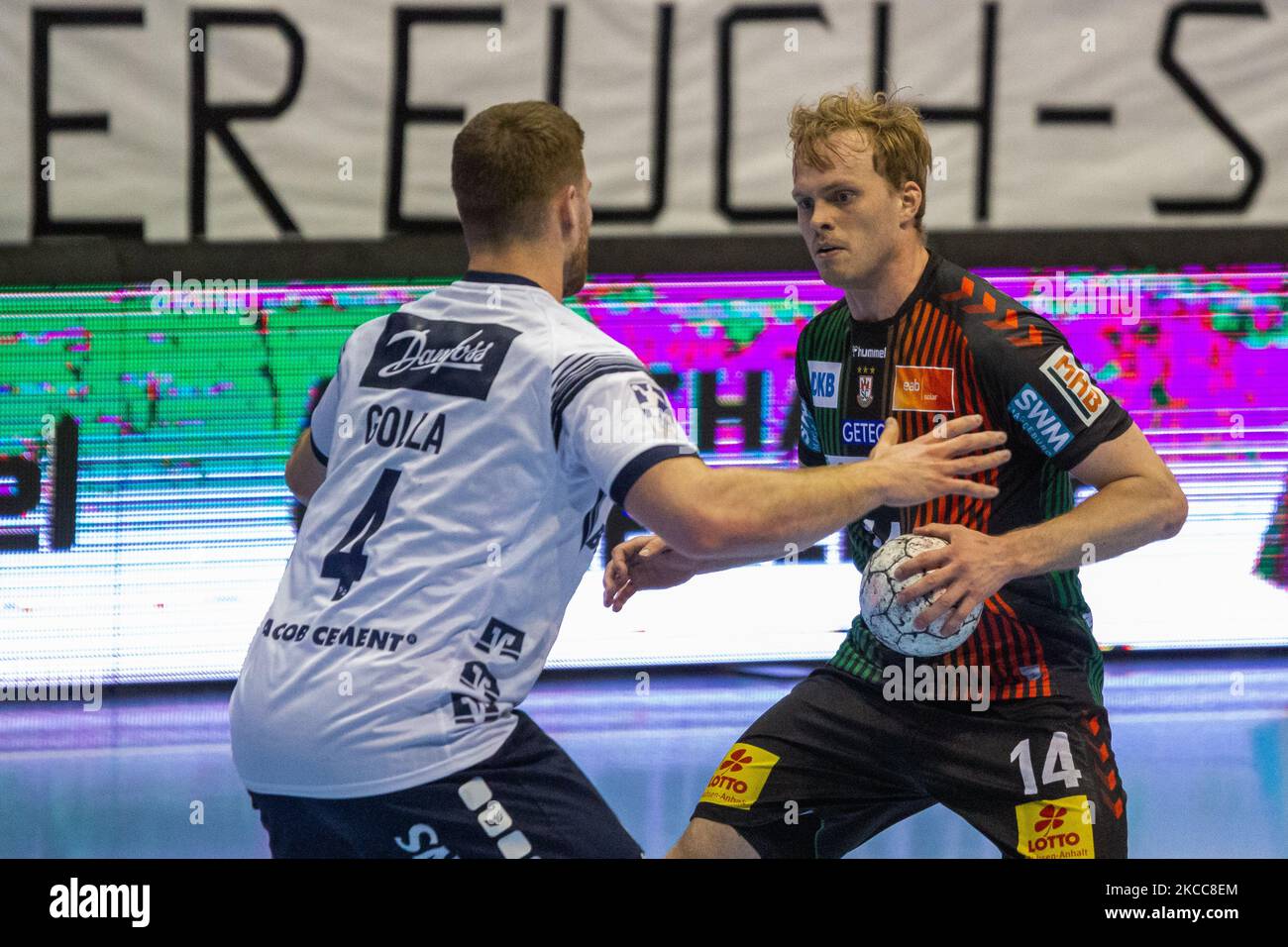 Ómar Ingi Magnússon (right) of Magdeburg is attacked by JOHANNES GOLLA (left) of SG Flensburg-Handewitt during the LIQUI MOLY Handball-Bundesliga match between SC Magdeburg and SG Flensburg-Handewitt at GETEC-Arena on April 04, 2021 in Magdeburg, Germany. (Photo by Peter Niedung/NurPhoto) Stock Photo