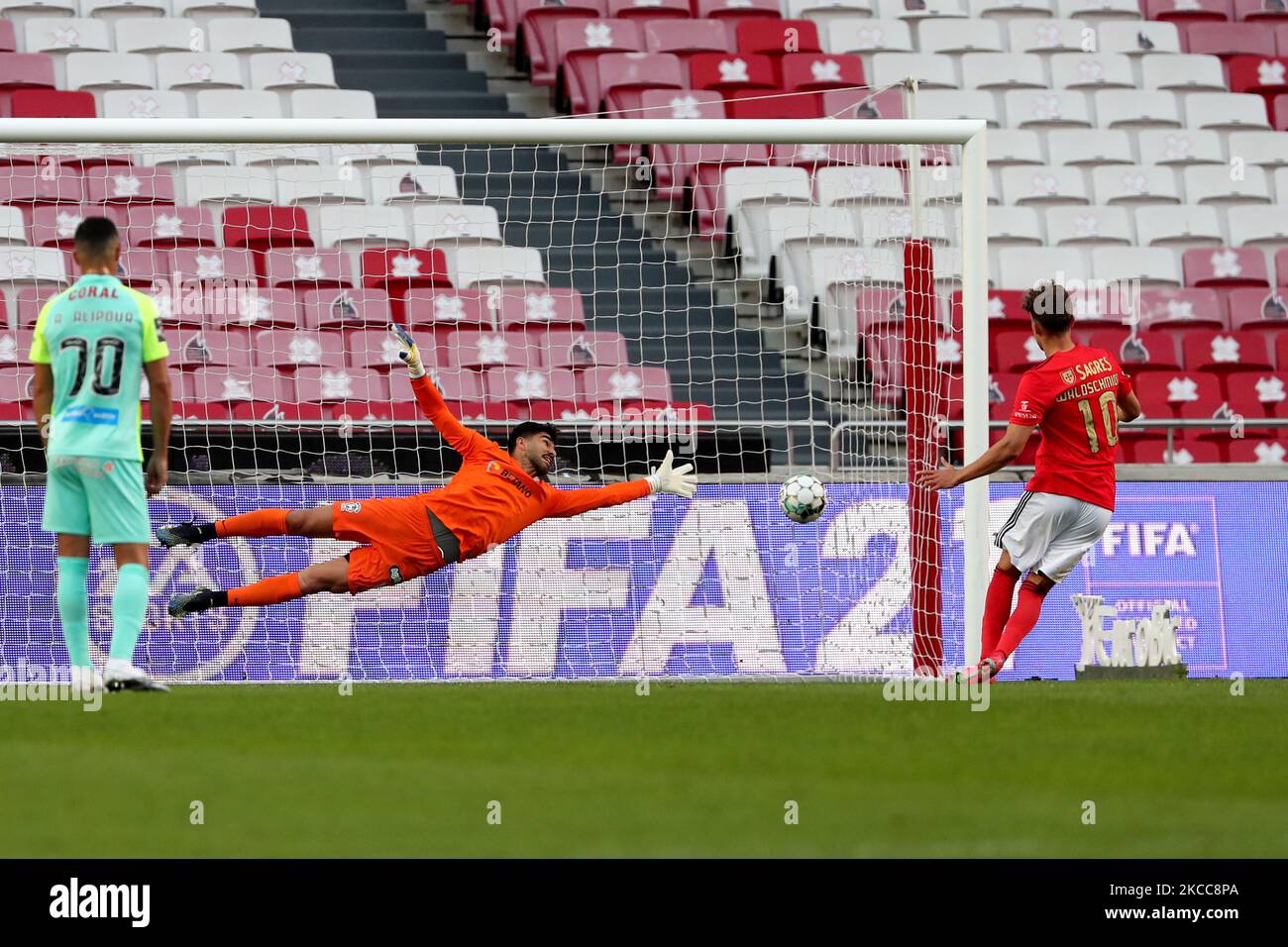 Luca Waldschmidt of SL Benfica shoots to score a penalty during the Portuguese League football match between SL Benfica and CS Maritimo at the Luz stadium in Lisbon, Portugal on April 5, 2021. (Photo by Pedro FiÃºza/NurPhoto) Stock Photo