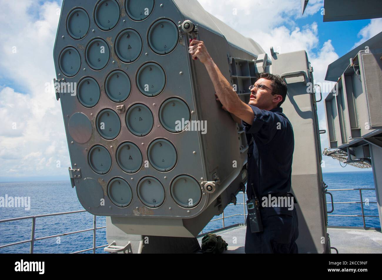 Fire Controlman performs maintenance on a rolling airframe missile system. Stock Photo