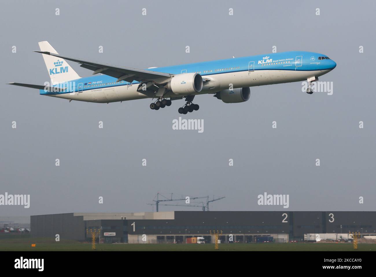 KLM Royal Dutch Airlones Boeing 777-300 aircraft as seen flying on final approach for landing at Amsterdam Schiphol AMS EHAM international airport. The wide body airplane made for long haul flights has the registration PH-BVG, the name Nationaal Park Wolong / Wolong National Nature Reserve and is powered by 2x GE jet engines. KLM Koninklijke Luchtvaart Maatschappij N.V. is the flag carrier of the Netherlands with hub in Amsterdam, the airline is the oldest in the world, member of SkyTeam aviation alliance and is owned by Air France - KLM Group. According to local and international media in Apr Stock Photo