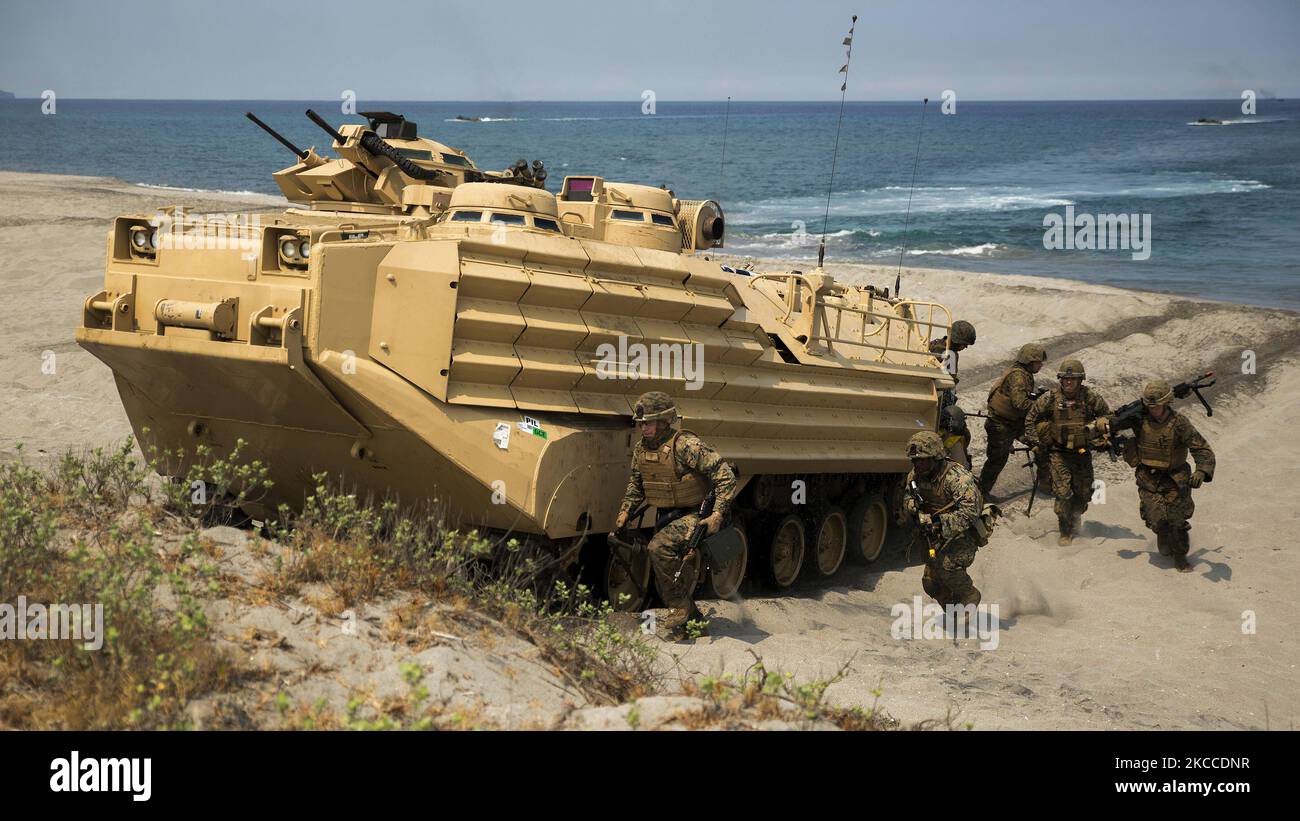 U.S. Marines exit an amphibious assault vehicle on North Beach in the Philippines. Stock Photo