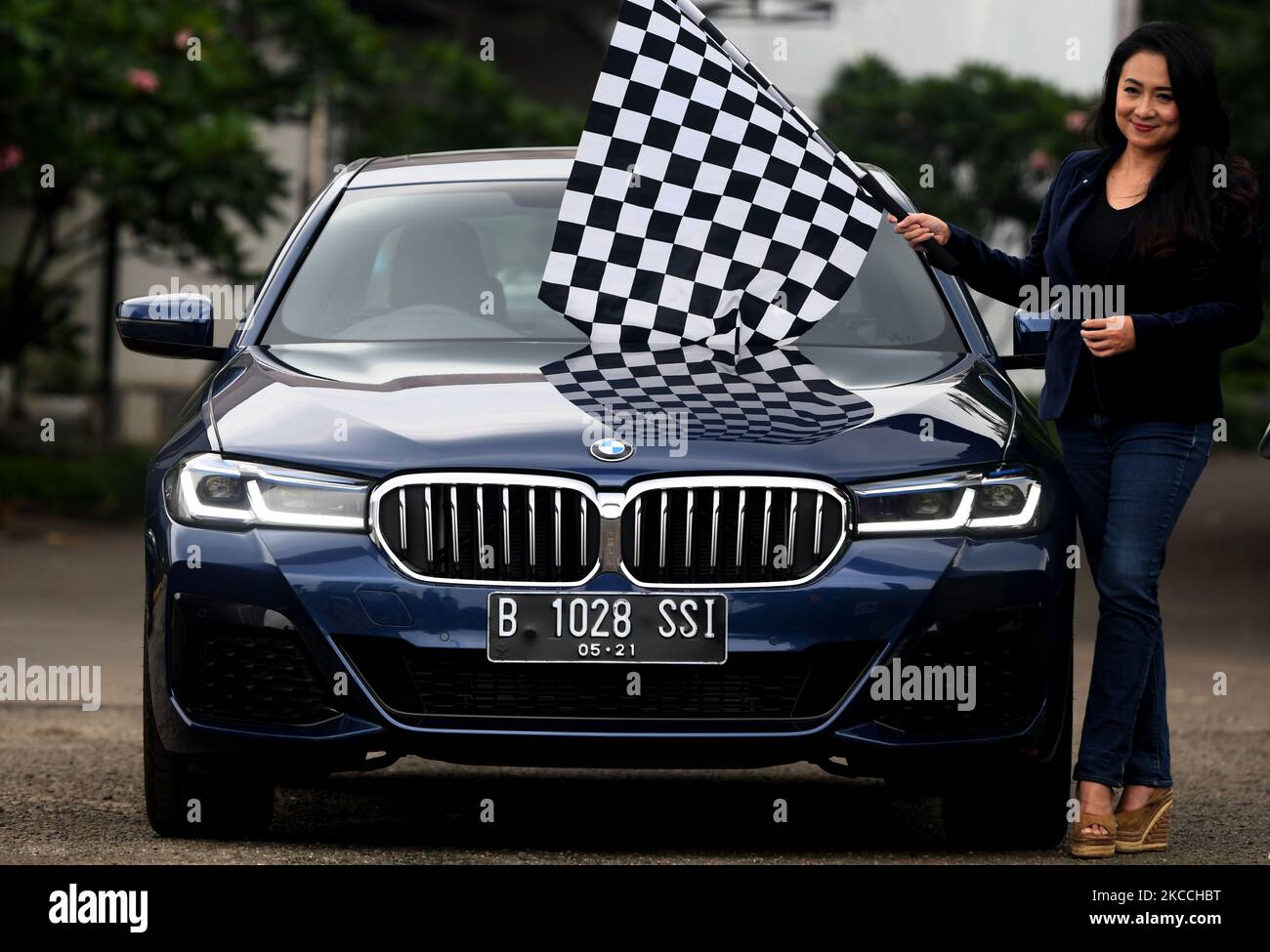Director of Communications BMW Group Indonesia Jodie O'tania showing the latest BMW ''The New 5'' Type BMW 520i M Sport at the BMW Test Day event in Karawaci, Tangerang, Banten, on April, 10, 2021. Business sedan car assembled in Indonesia It features an exclusive interior and comfort while in or in the wheelhouse with safety sensor facilities while driving and is priced at IDR 1.1 billion. (Photo by Dasril Roszandi/NurPhoto) Stock Photo