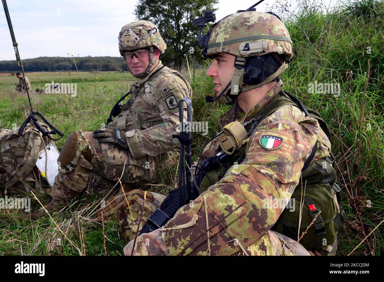A U.S. paratrooper and an Italian soldier in Siena, Italy. Stock Photo