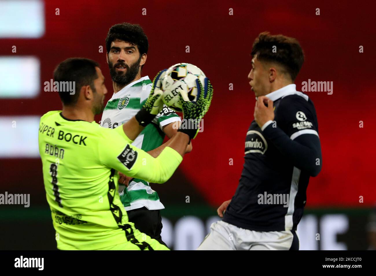 Luis Neto of Sporting CP (C ) looks on as Sporting's goalkeeper Antonio Adan makes a safe during the Portuguese League football match between Sporting CP and FC Famalicao at Jose Alvalade stadium in Lisbon, Portugal on April 11, 2021. (Photo by Pedro FiÃºza/NurPhoto) Stock Photo
