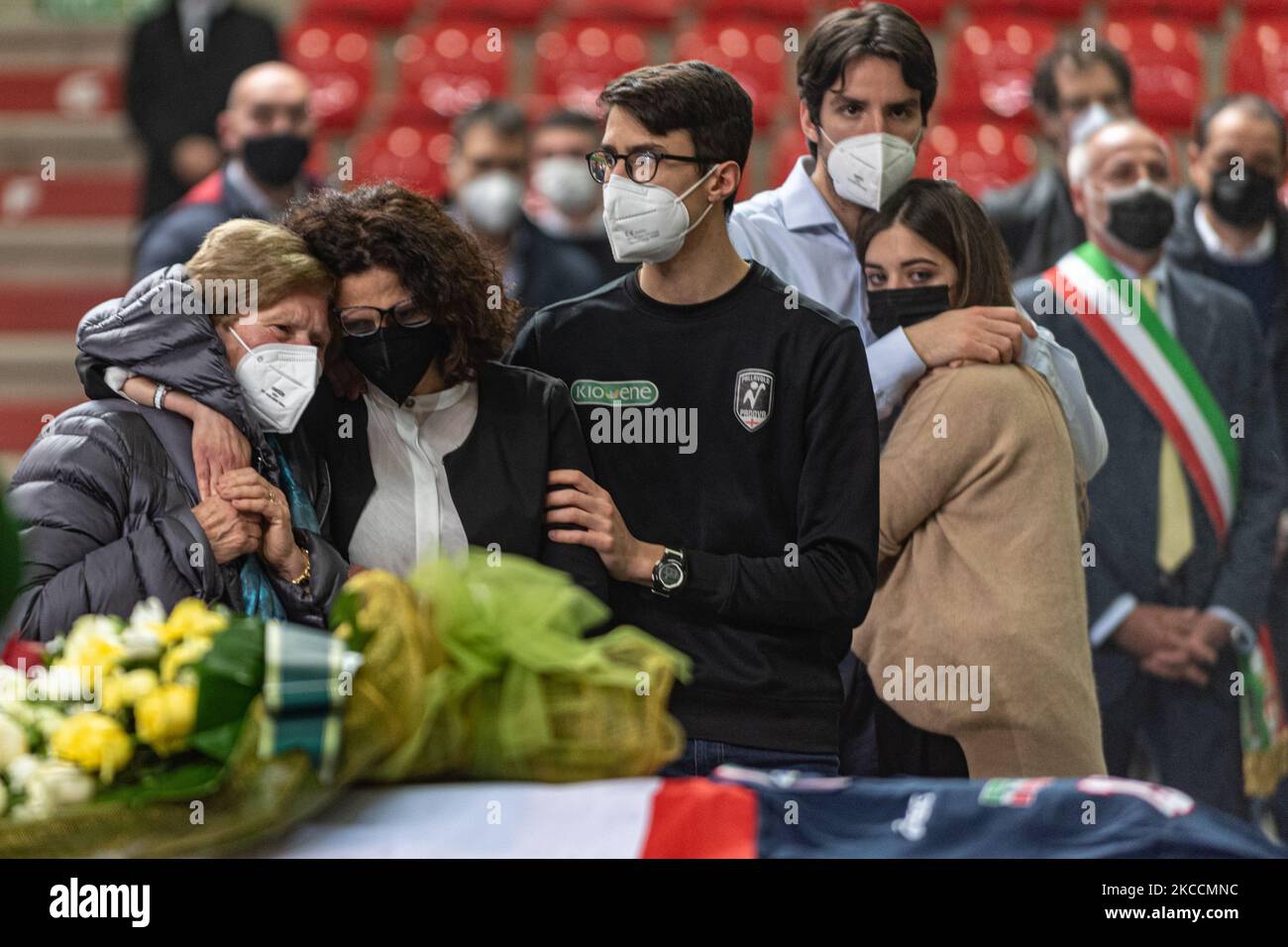 In the picture from the left the mother of Michele Pasinato hugs his wife Silvia and children Giorgio and Edoardo. The funeral of the volleyball player of the Italian national team, Michele Pasinato, struck down at the age of 52 by a tumor, took place today in Padua at the Kioene Arena. His teammates Martinelli, Zorzi, Lucchetta and Velasco are present. The city of Padua, where he coached the youth volleyball team, has tightened around his memory. On April 12, 2021, in Padova, Italy. (Photo by Roberto Silvino/NurPhoto) Stock Photo