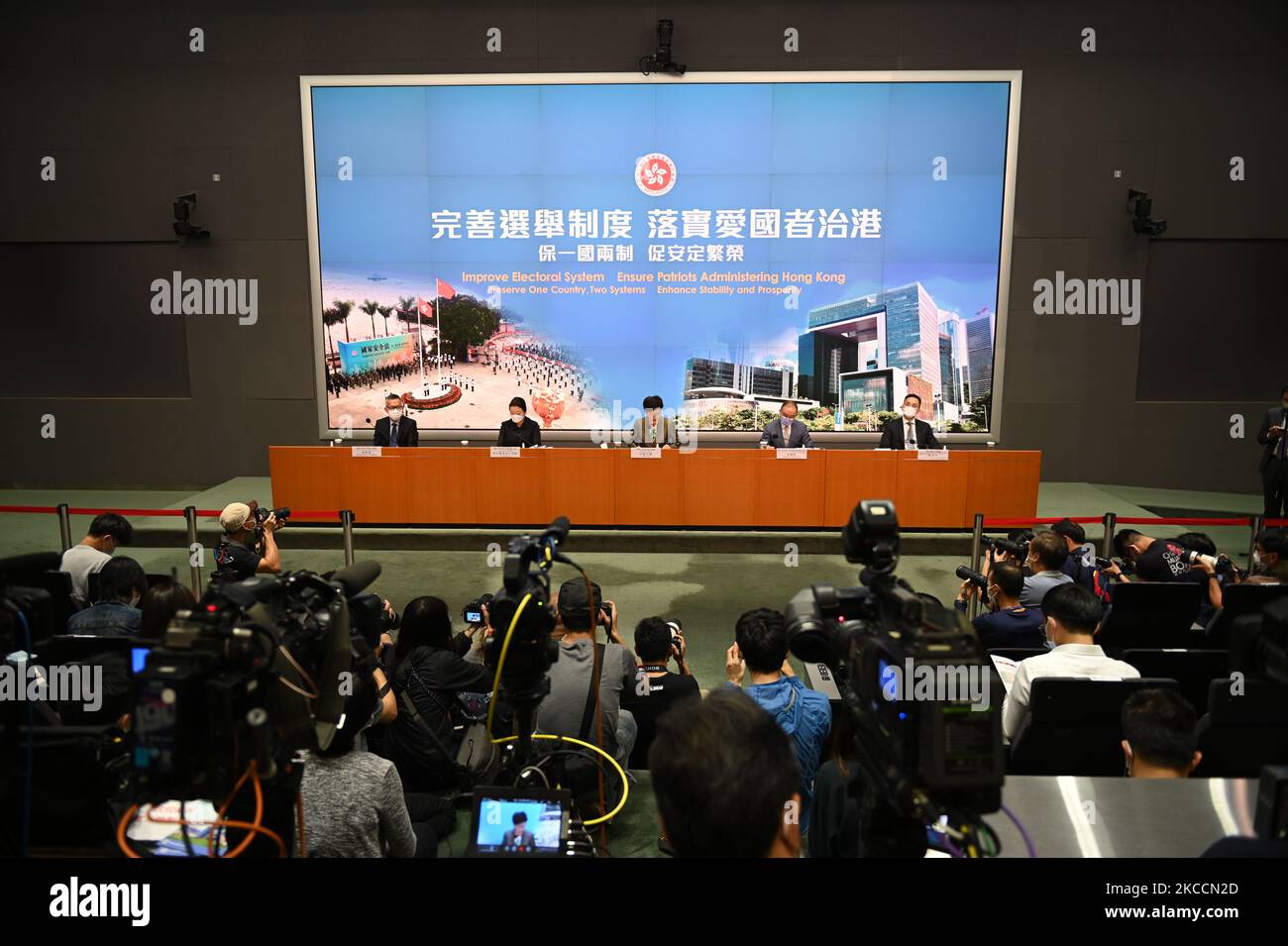 From Left to Right Ms Llewellyn Mui, Acting Officer(Special Duties), Ms Teresa Cheng, Secretary for Justice, Mrs Carrie Lam, Chief Executive of Hong Kong, Mr Eric Tsang, Secretary for constitution and mainland affairs, Mr Roy Tang, permanent secretary for Constitutional and Mainland affairs during a press conference on 'Improving Electoral System' in Hong Kong, China, on April 13, 2021. The government is formally proposing to make it a crime for people to urge others to cast blank or spoiled ballots, or not vote at all, as it unveiled a host of bills to amend local laws in line with the sweepi Stock Photo