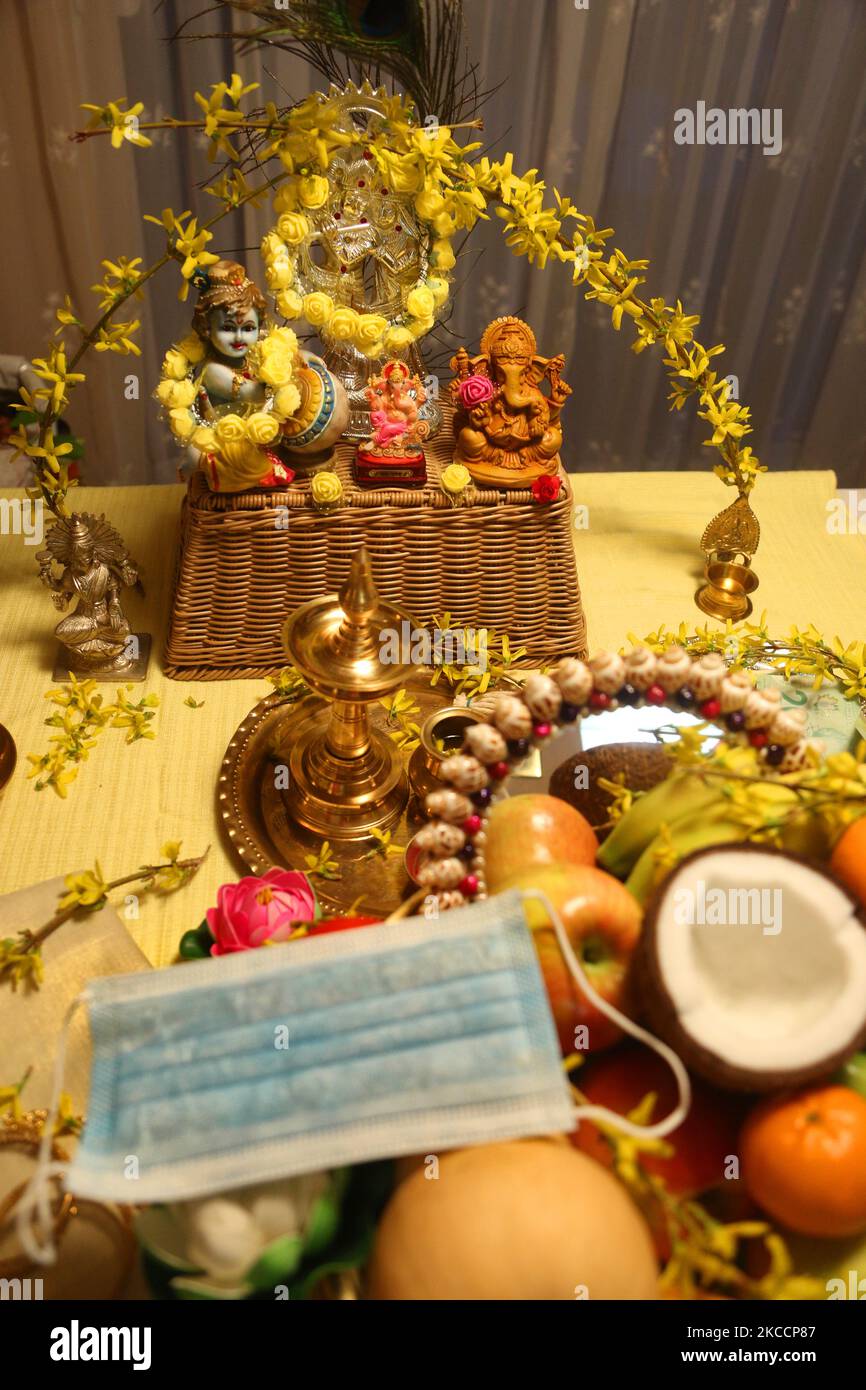 Face mask by a traditional Vishu kani (Vishukani) setting with a ...