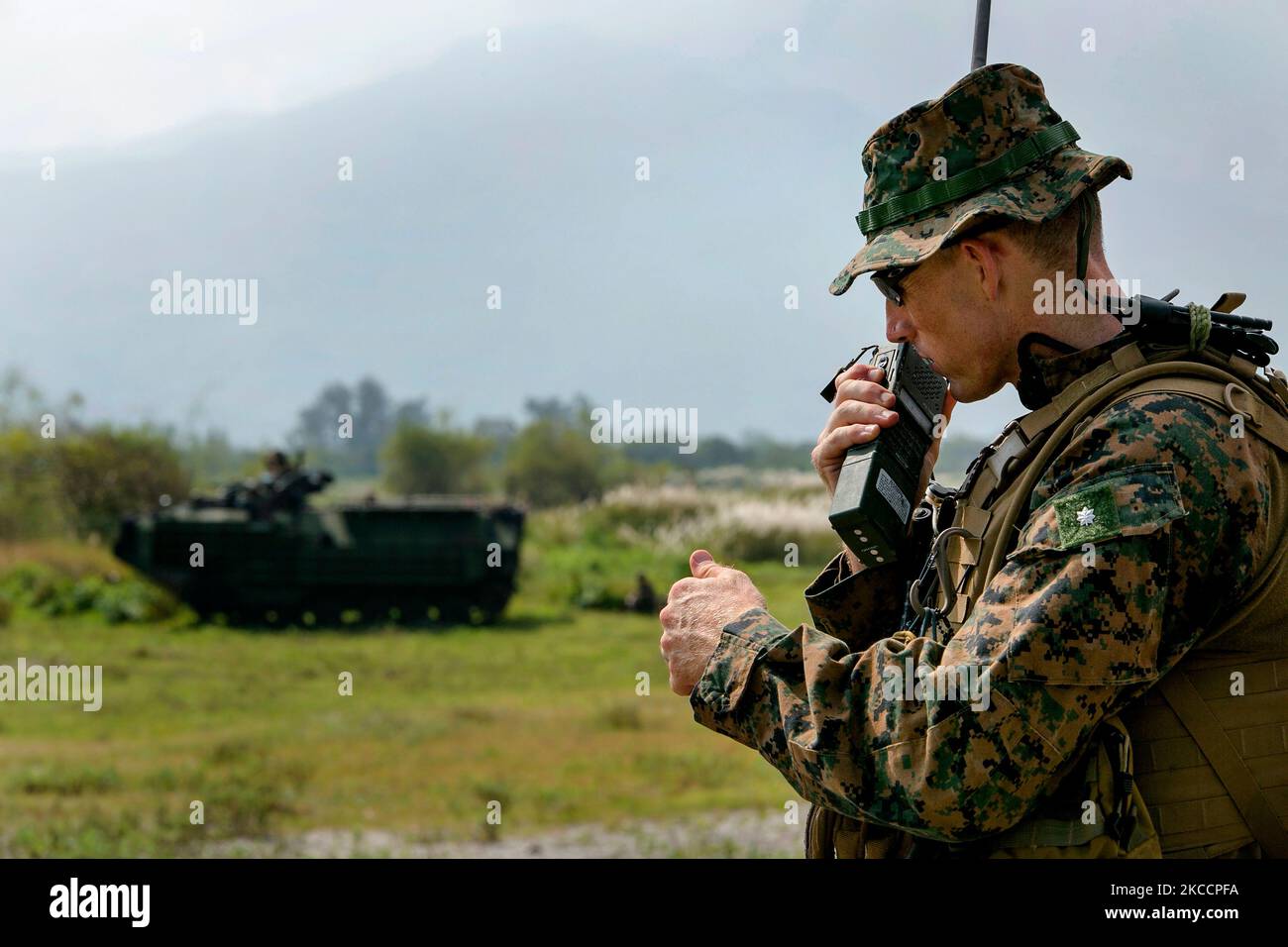 U.S. Marine checks communications. Stock Photo