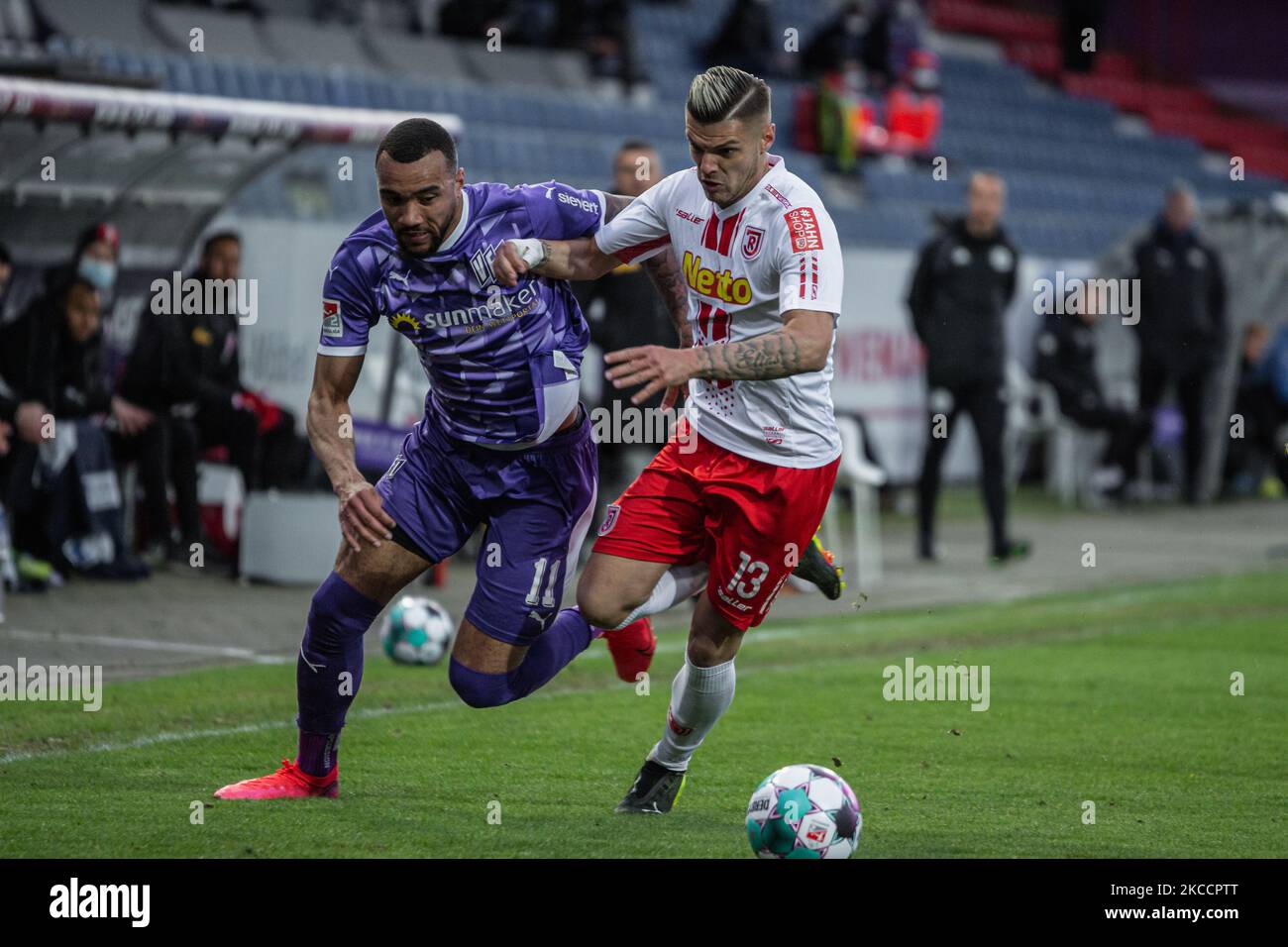 Jay-Roy Grot (left) of VfL Osnabrueck and Erik Wekesser (right) of SSV Jahn Regensburg battle for the ball during the Second Bundesliga match between VfL Osnabrueck and SSV Jahn Regensburg at Bremer Bruecker on April 14, 2021 in Osnabrueck, Germany. (Photo by Peter Niedung/NurPhoto) Stock Photo