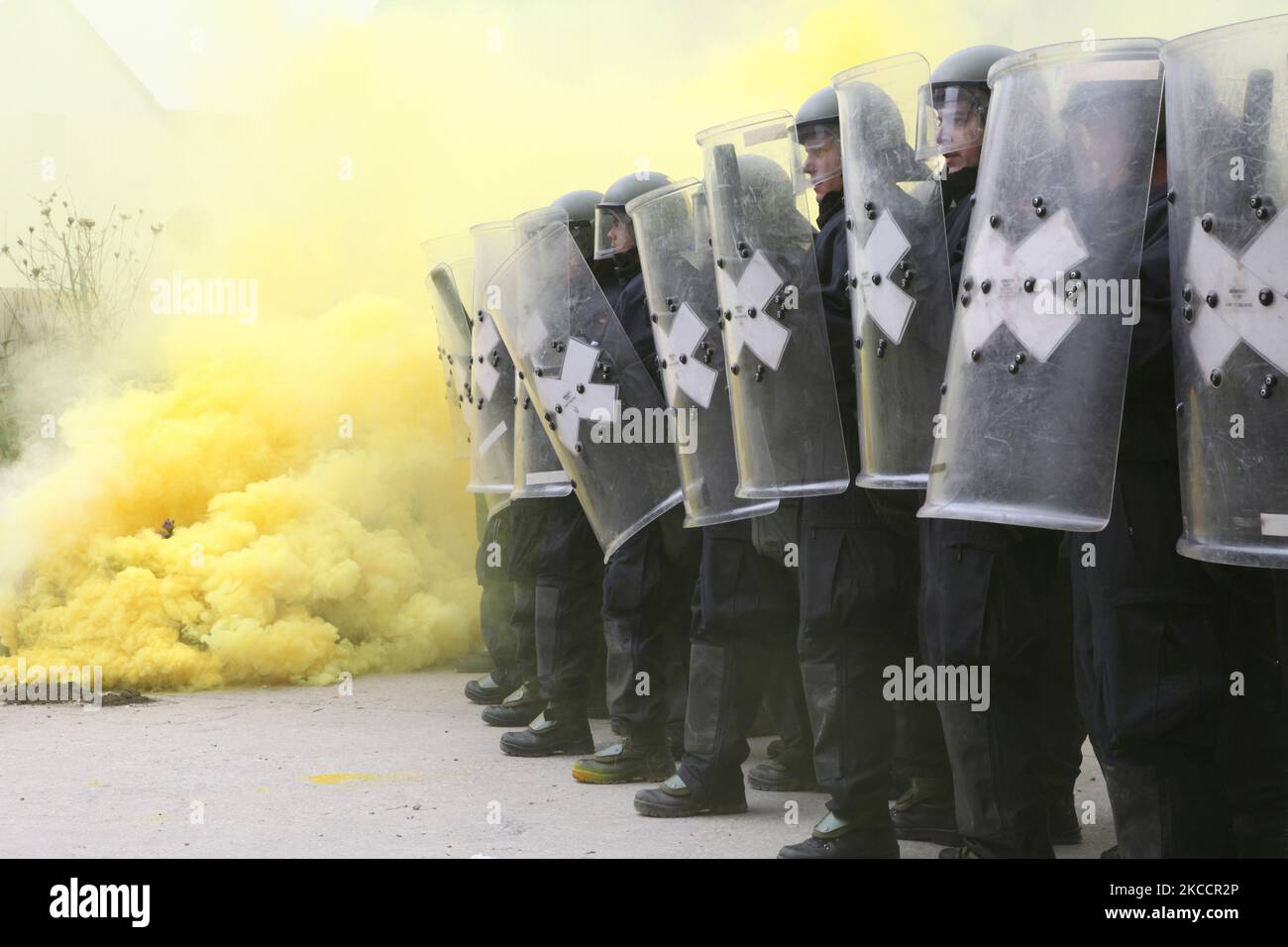 German soldiers form a crash line while conducting riot control training. Stock Photo