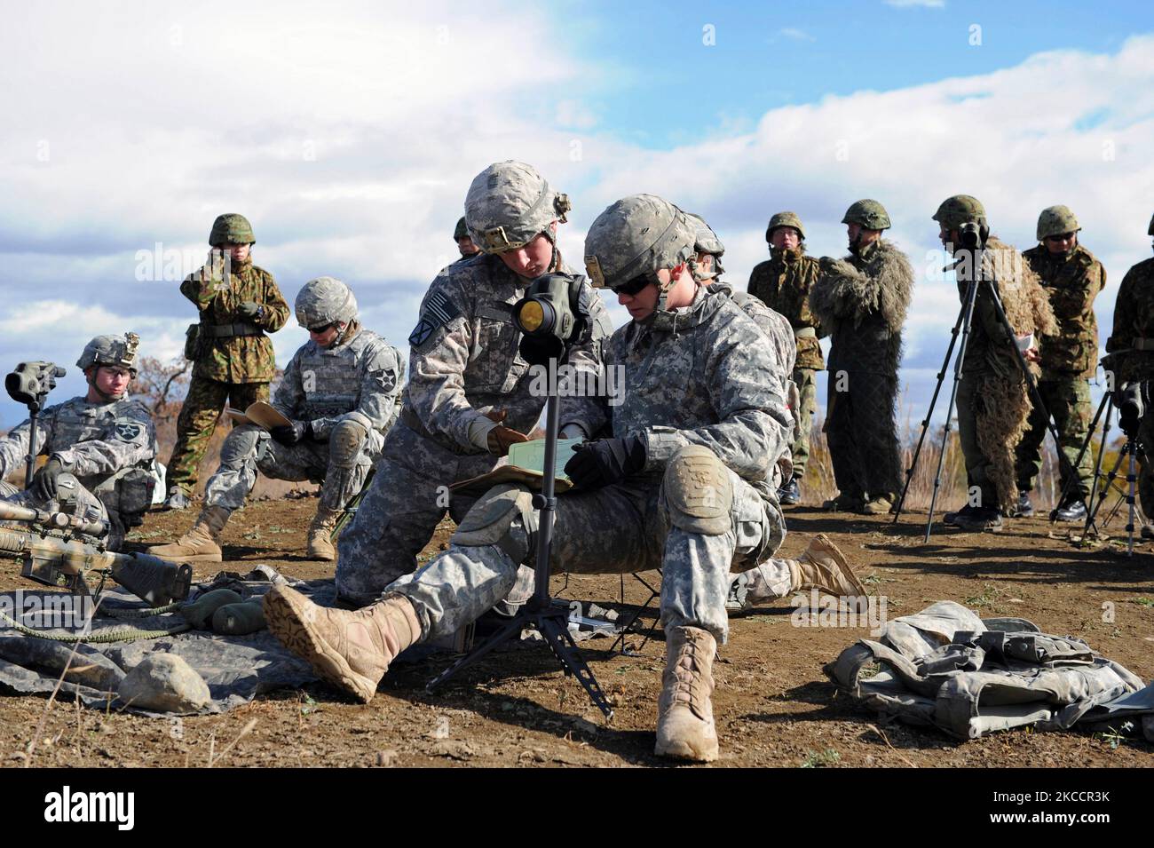 U.S. Army Soldiers review target locations for training. Stock Photo