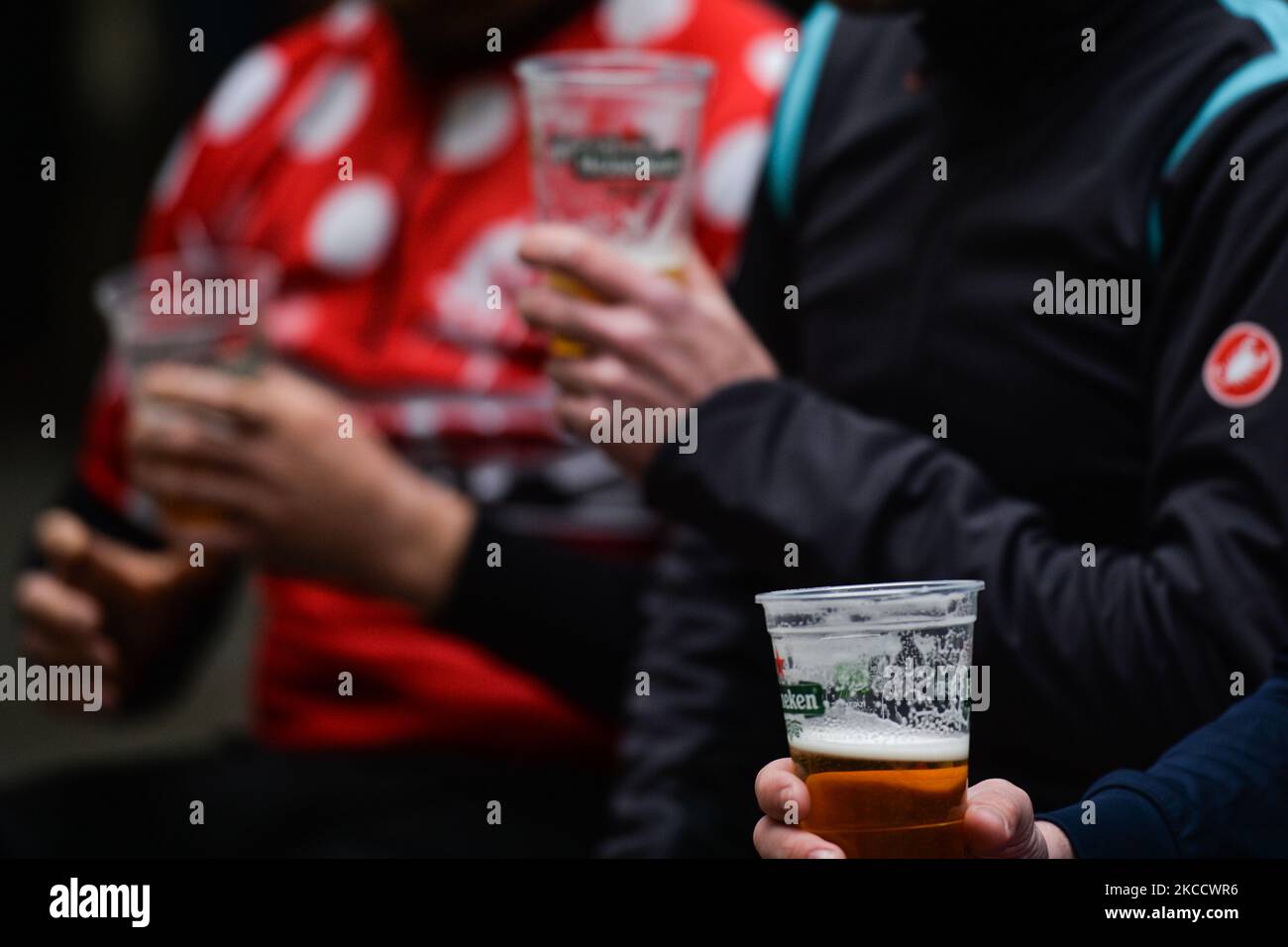 People drinking takeaway beer in plastic cups in Dublin city center