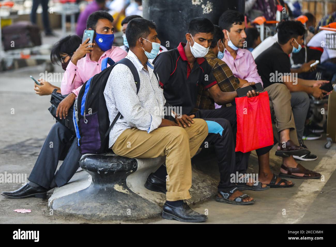 Migrant workers waits for the flights as those are cancelled as authorities concerned of the respective destinations – Riyadh, Dammam, Dubai, and Jeddah – did not give landing permission and due to shortage of passengers at Hazrat Shahjalal International Airport in Dhaka on April 17, 2021. The initiative to send Bangladeshi migrant workers back to their desired countries experienced a major hiccup at the beginning as most of the special flights scheduled for Saturday had to be cancelled. (Photo by Ahmed Salahuddin/NurPhoto) Stock Photo