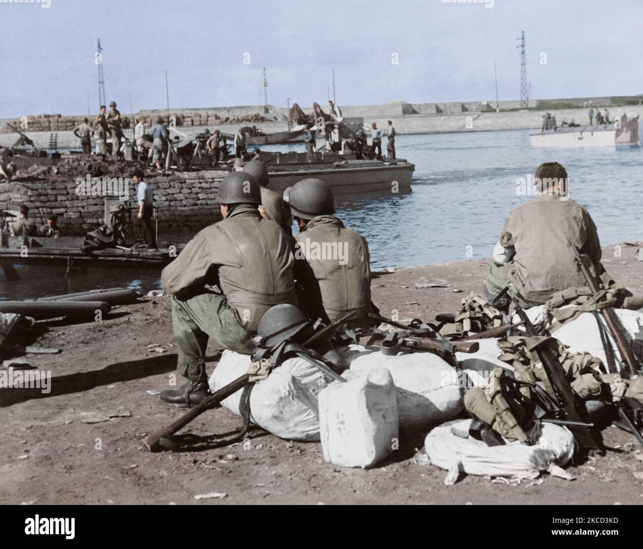 U.S. troops taking a break at the harbor after operations in Fedala, Morocco, circa 1942. Stock Photo
