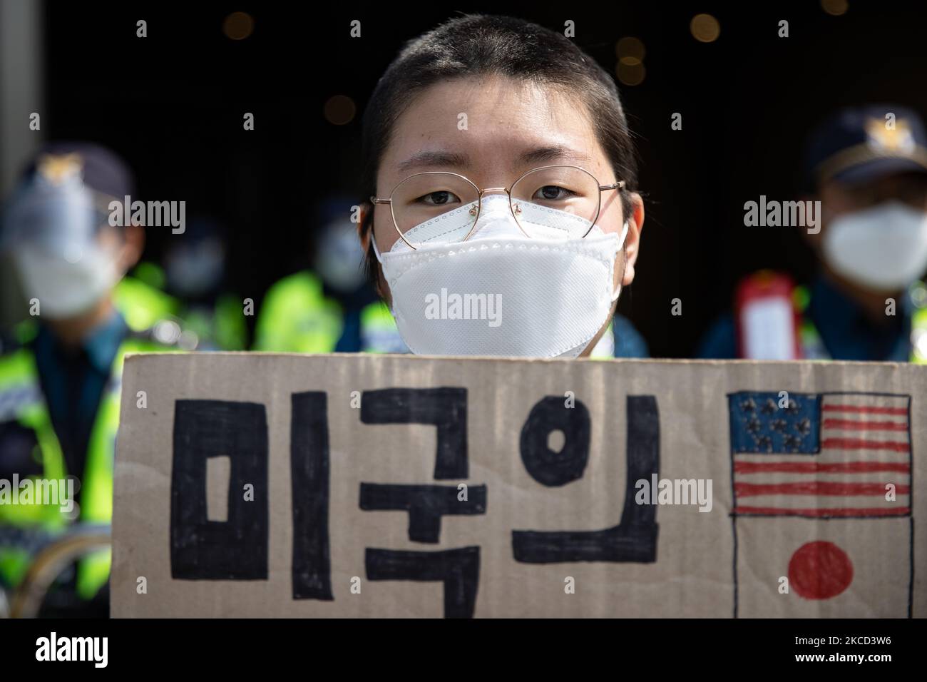 A protester holds a banner written in Don't release radioactive contaminated water! during a protest against Japan's decision to release radioactive water from the Fukushima Nuclear Power Plant into the ocean, in front of the Japanese embassy on 20 April, 2021 in Seoul, South Korea. On April 13th, the Japanese government decided to discharge radioactive water from the crippled Fukushima nuclear plant into the Pacific Ocean. (Photo by Chris Jung/NurPhoto) Stock Photo