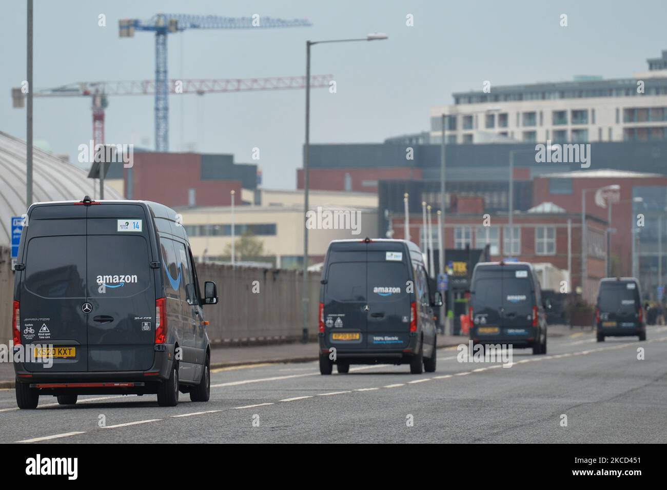 Amazon Prime vans seen in the Titanic Quarter in Belfast. Packages are shipped to the delivery station from Amazon fulfillment and sorting centers and loaded onto vehicles for delivery to Amazon customers in the Belfast area. On Tuesday, April 20, 2021, in Belfast, Northern Ireland. (Photo by Artur Widak/NurPhoto) Stock Photo