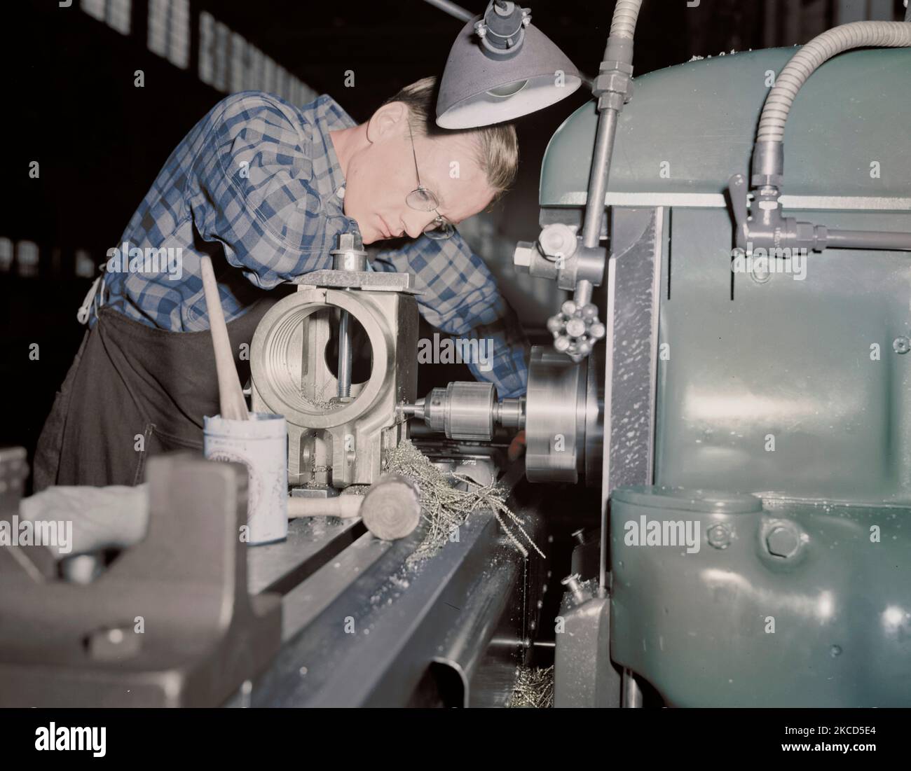 Factory worker producing 37mm guns and gun mounts, 1942. Stock Photo