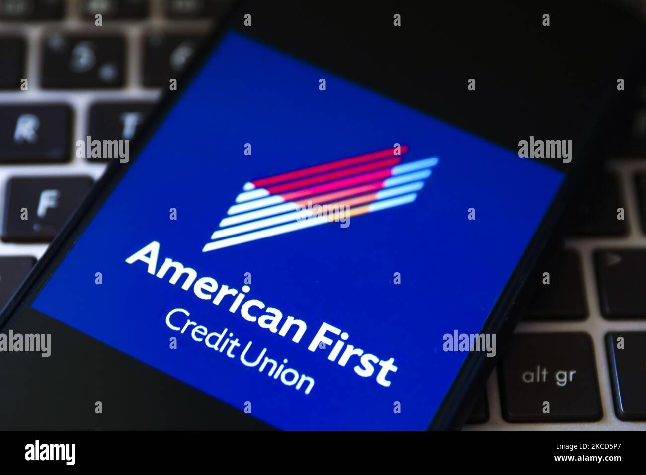 American First Credit Union logo is displayed on a mobile phone screen