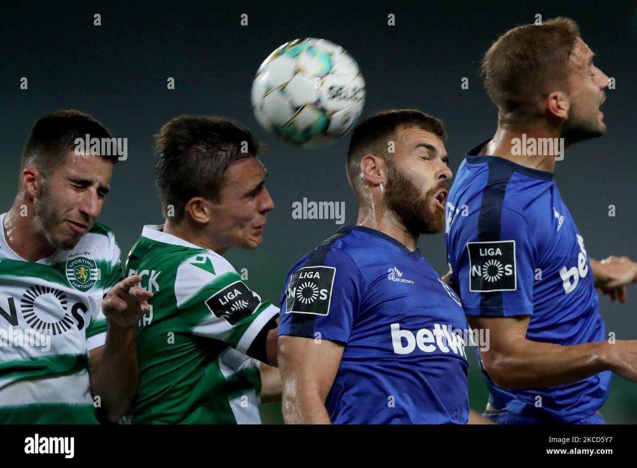 Gonalo Inacio (L) and Joao Palhinha of Sporting CP (2nd L) fights for the ball with Miguel Cardoso (2nd R ) and Goncalo Silva of Belenenses SAD during the Portuguese League football match between Sporting CP and Belenenses SAD at Jose Alvalade stadium in Lisbon, Portugal on April 21, 2021. (Photo by Pedro FiÃºza/NurPhoto) Stock Photo