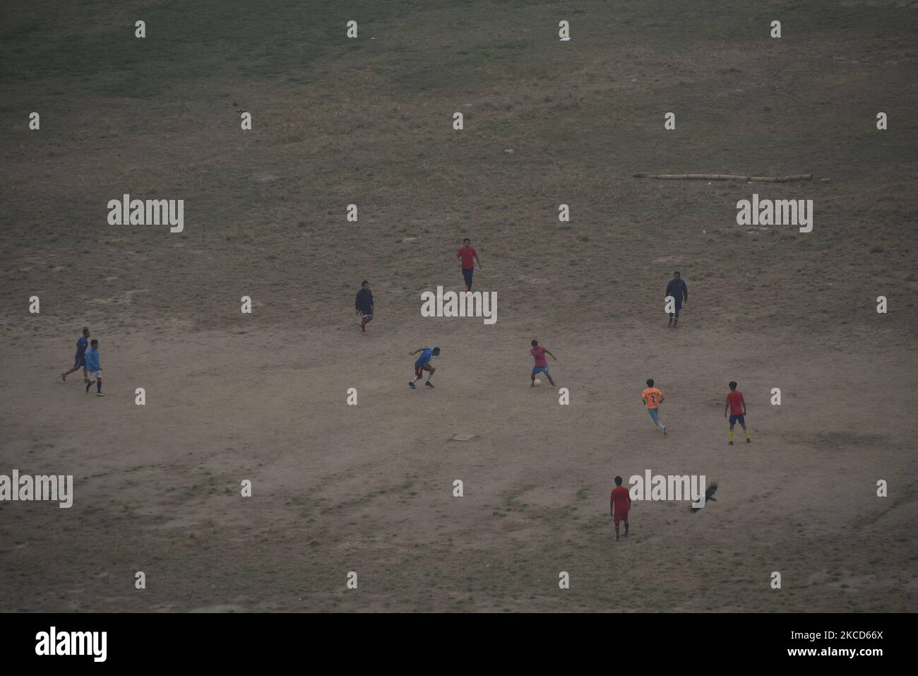 Nepalese people playing football in Tundikhel ground seen from from newly constructed historic Dharahara tower in Kathmandu, Nepal on Wednesday, April 21, 2021. Prime Minister KP Sharma Oli is scheduled to inaugurate Dharahara on 24 April. Dharahara tower which was destroyed during the devastating earthquake of 2015. (Photo by Narayan Maharjan/NurPhoto) Stock Photo