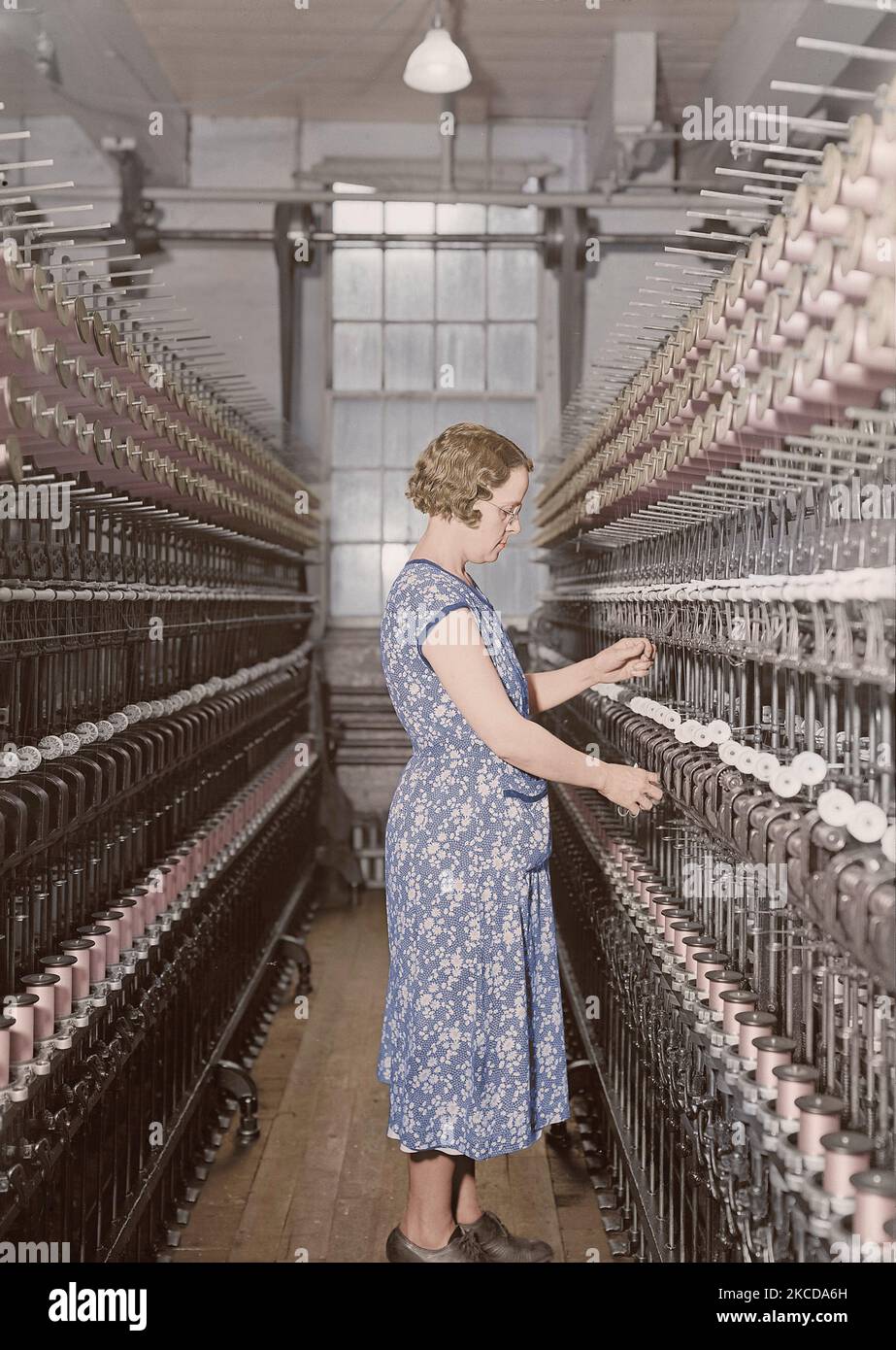 Woman doubling silk at the William Skinner and Sons Silk Mill, 1936. Stock Photo