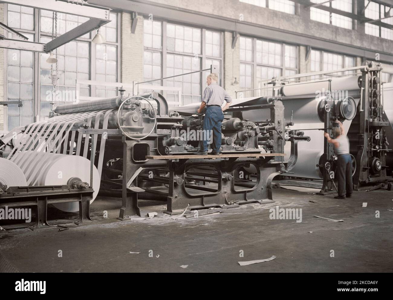 Workers making matchboard on cylinder machines, 1936. Stock Photo