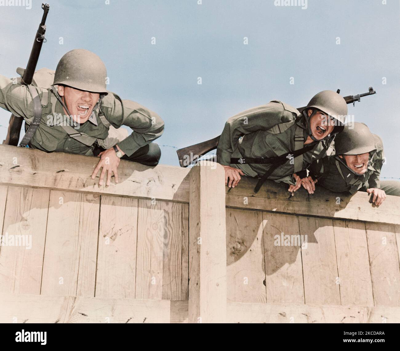 Soldiers topping the six foot wall at Camp Edwards, Massachusetts, circa 1942. Stock Photo