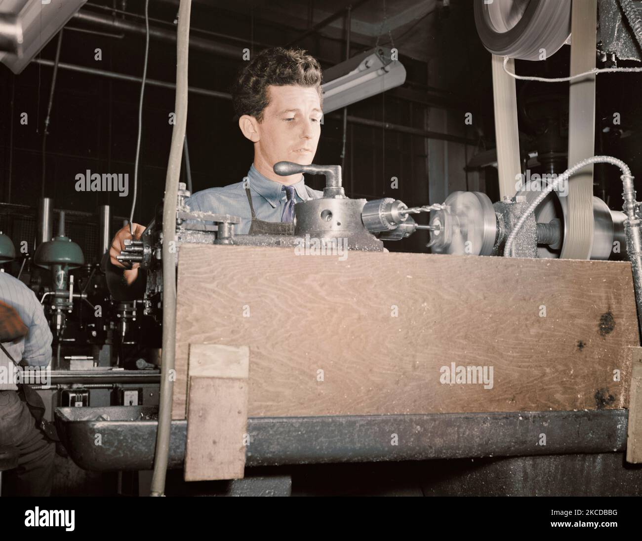 Worker operating at a turret lathe at the Warren McArthur plant, 1942. Stock Photo
