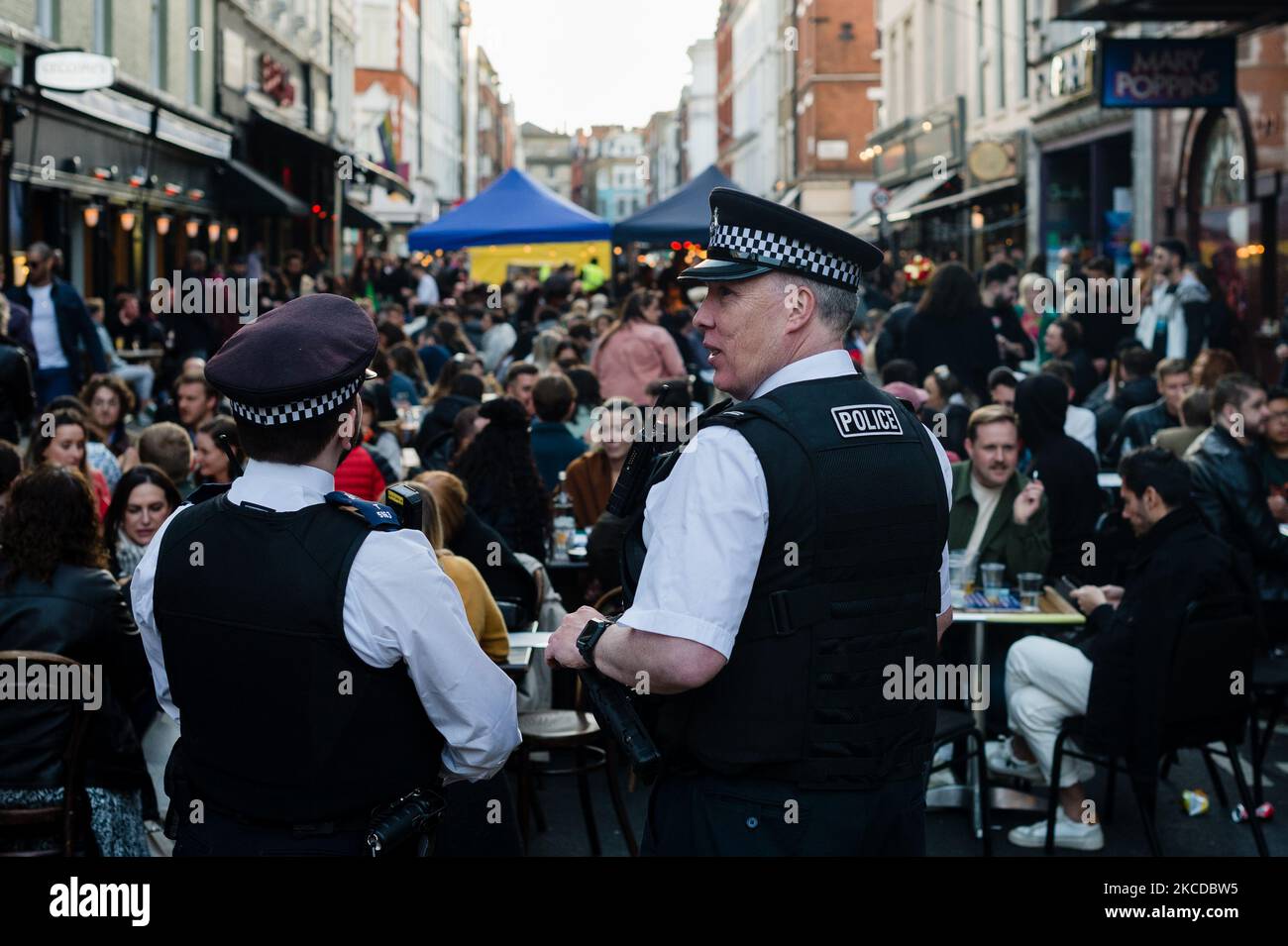 Police monitoring outdoor street dining areas, as lockdown restrictions