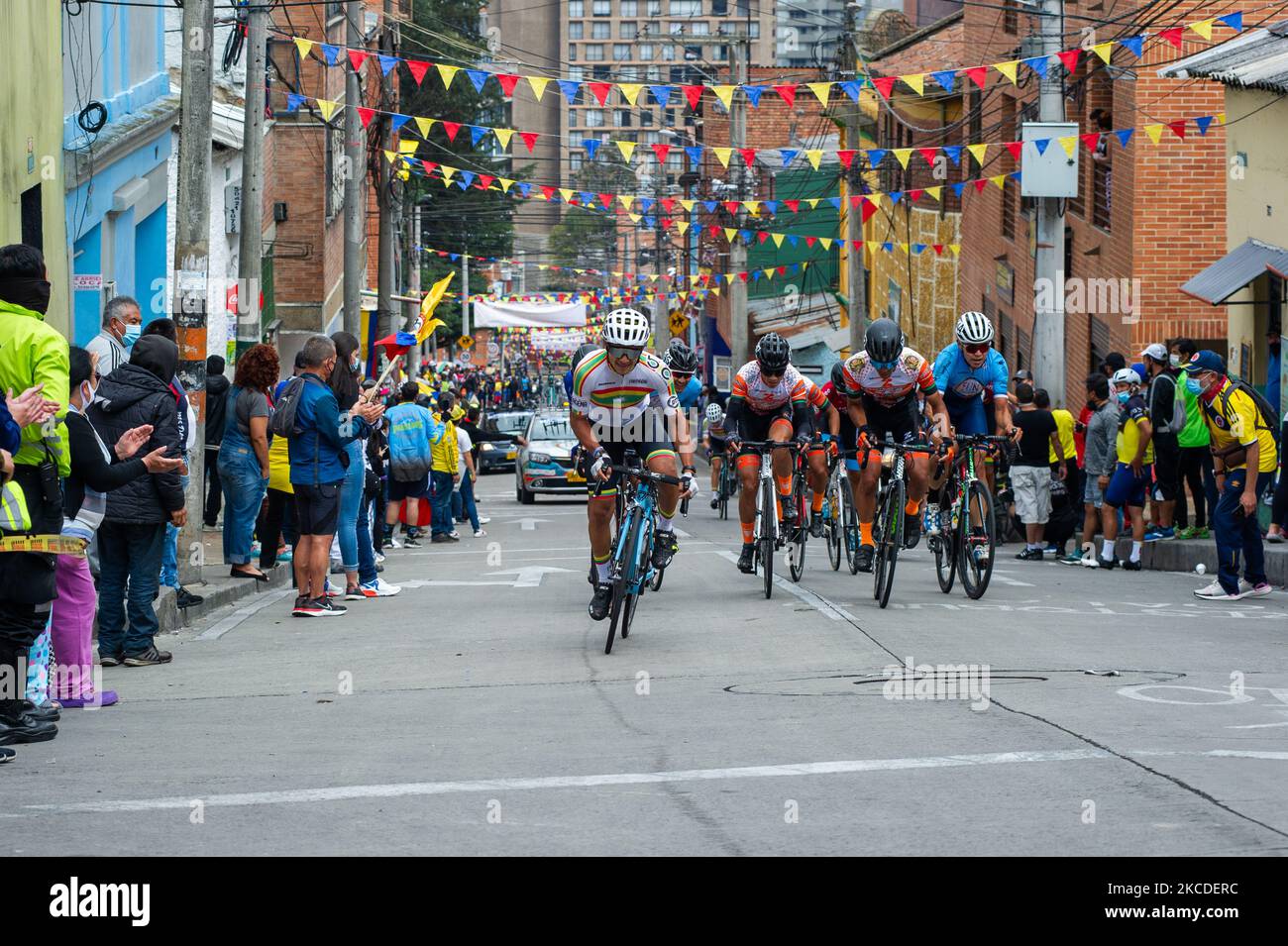 Ciclysts participating in the 2021 Vuelta a Colombia race final in Bogota are cheered up by locals from the Perserverancia neighborhood in Bogota, Colombia on April 25, 2021 won by the Colombian ciclyst Tito Hernandez. (Photo by Sebastian Barros/NurPhoto) Stock Photo