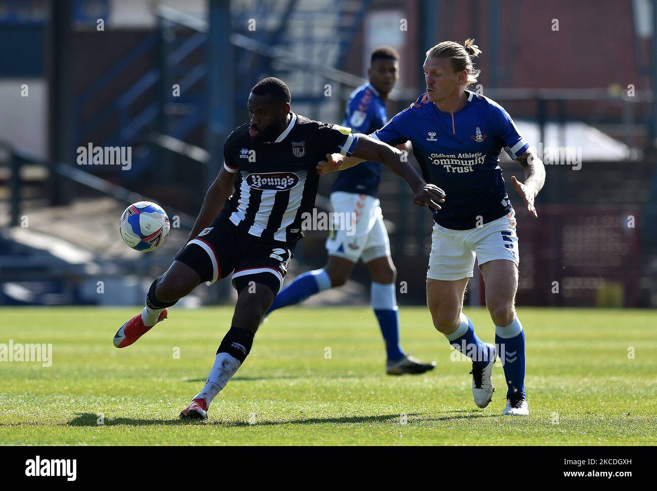 Oldham Athletic's Carl Piergianni tussles with Lenell John-Lewis of Grimsby Town during the Sky Bet League 2 match between Oldham Athletic and Grimsby Town at Boundary Park, Oldham, England on 24th April 2021. (Photo by Eddie Garvey/MI News/NurPhoto) Stock Photo