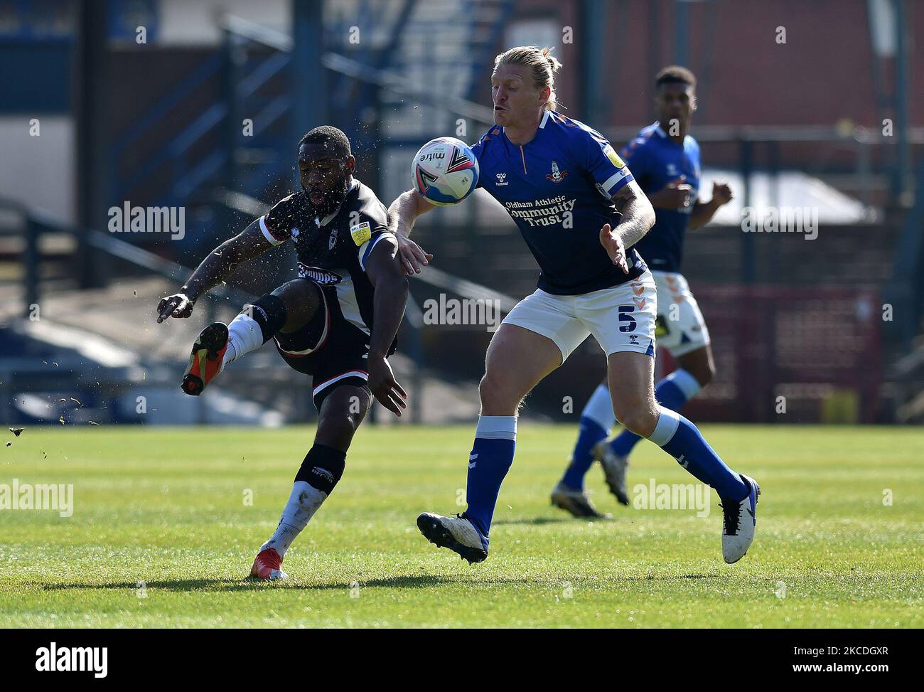OLDHAM, UK. APRIL 24TH Oldham Athletic's Carl Piergianni tussles with Lenell John-Lewis of Grimsby Town during the Sky Bet League 2 match between Oldham Athletic and Grimsby Town at Boundary Park, Oldham, England on 24th April 2021. (Photo by Eddie Garvey/MI News/NurPhoto) Stock Photo