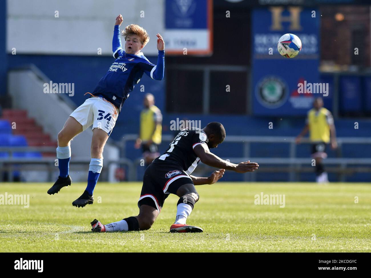 OLDHAM, UK. APRIL 24TH Oldham Athletic's Harry Vaughan tussles with Lenell John-Lewis of Grimsby Town during the Sky Bet League 2 match between Oldham Athletic and Grimsby Town at Boundary Park, Oldham, England on 24th April 2021. (Photo by Eddie Garvey/MI News/NurPhoto) Stock Photo