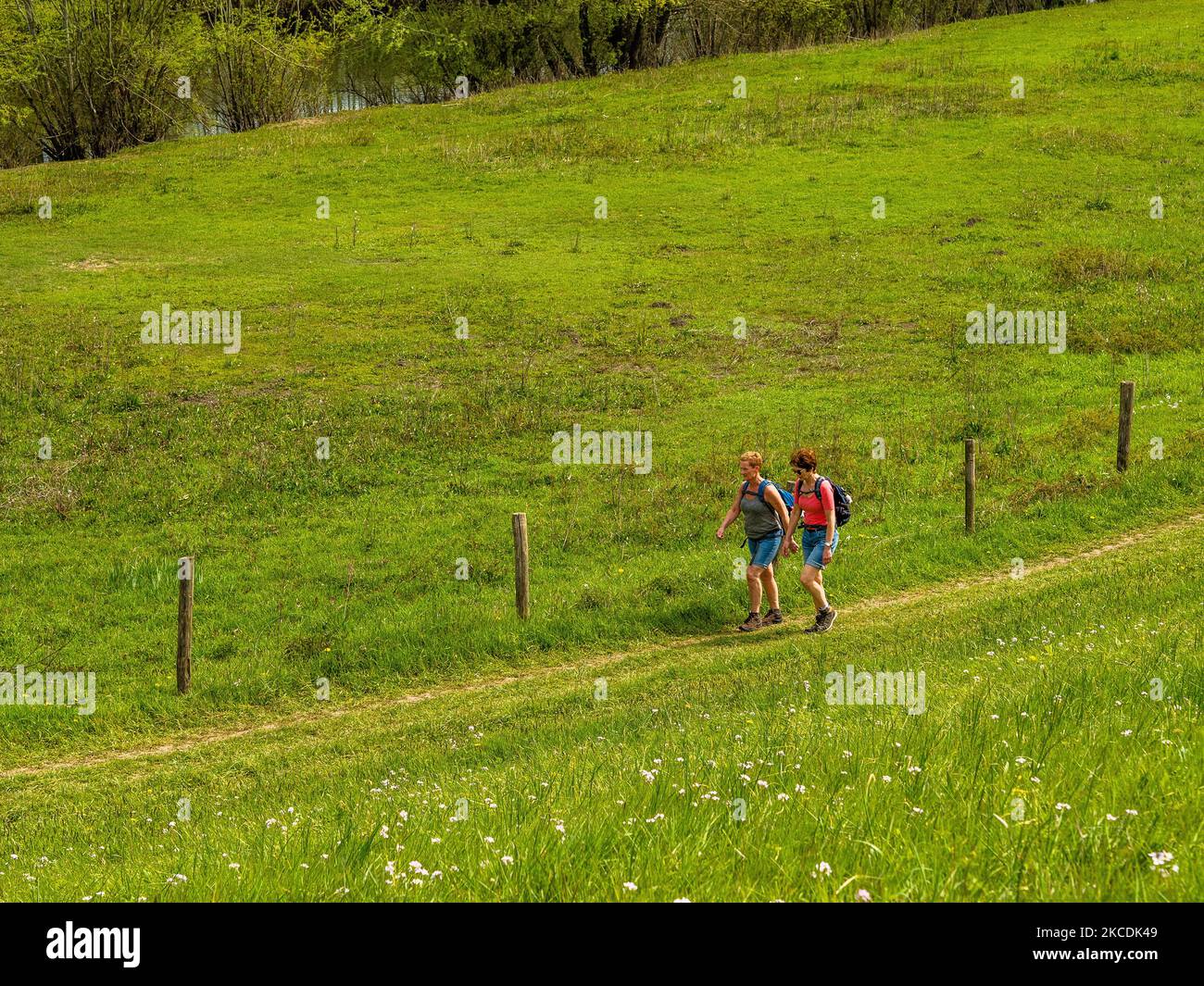 Two female walkers are walking around a dike, during the Spring temperatures in The Netherlands, on April 28th, 2021. (Photo by Romy Arroyo Fernandez/NurPhoto) Stock Photo
