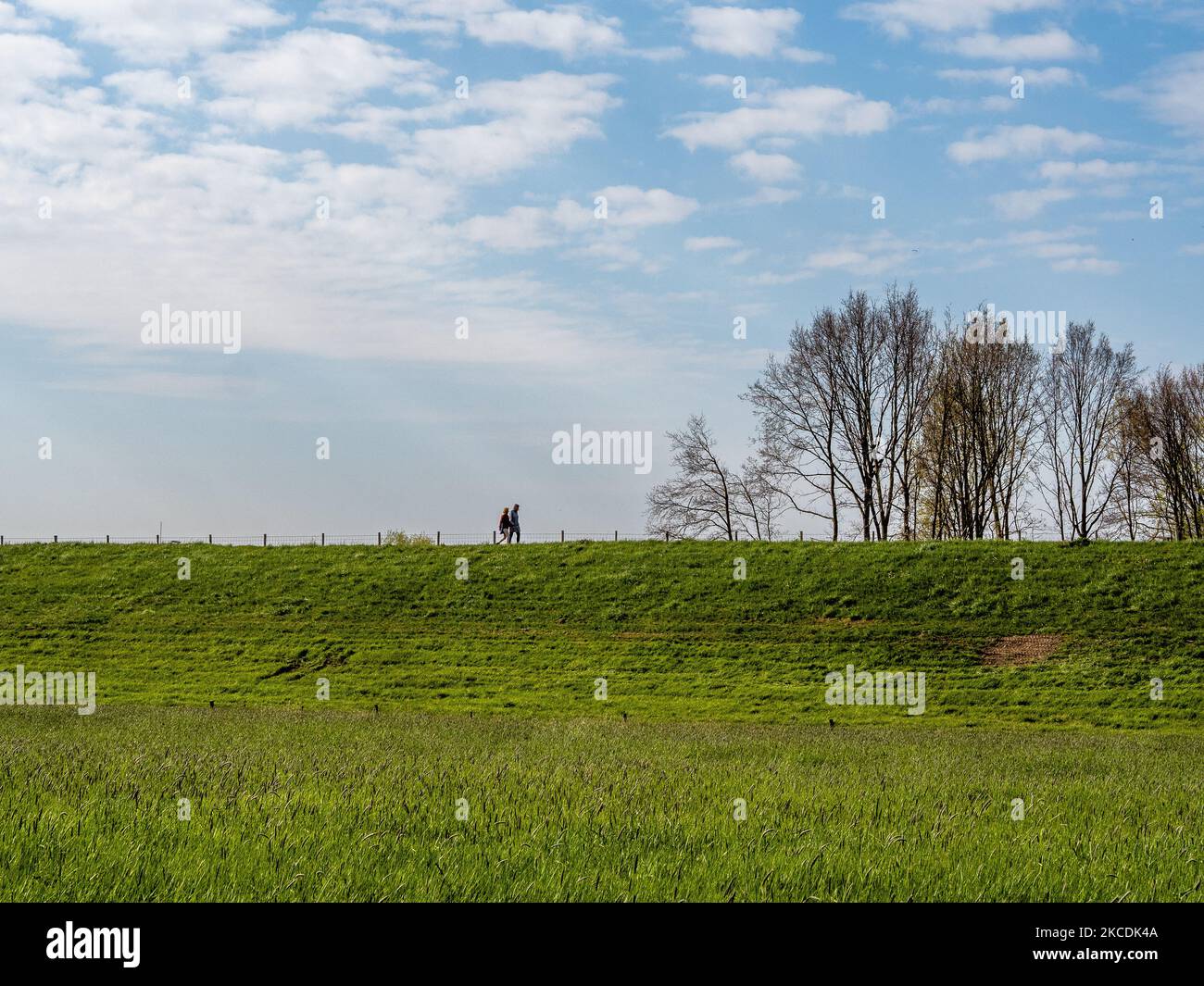 A couple is walking while enjoying the good weather, during the Spring temperatures in The Netherlands, on April 28th, 2021. (Photo by Romy Arroyo Fernandez/NurPhoto) Stock Photo