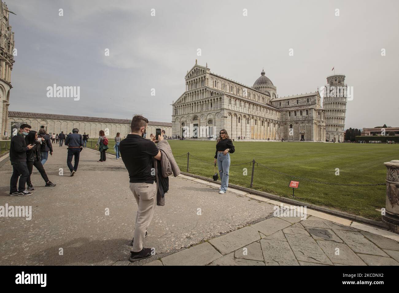 Tourists are back in the miracle square since the famous leaning tower has opened to the public, in Pisa, Italy, on May, 1st, 2021. After months of harsh lockdown, Italy has decided to open museums, arts buildings and theatres. (Photo by Enrico Mattia Del Punta/NurPhoto) Stock Photo