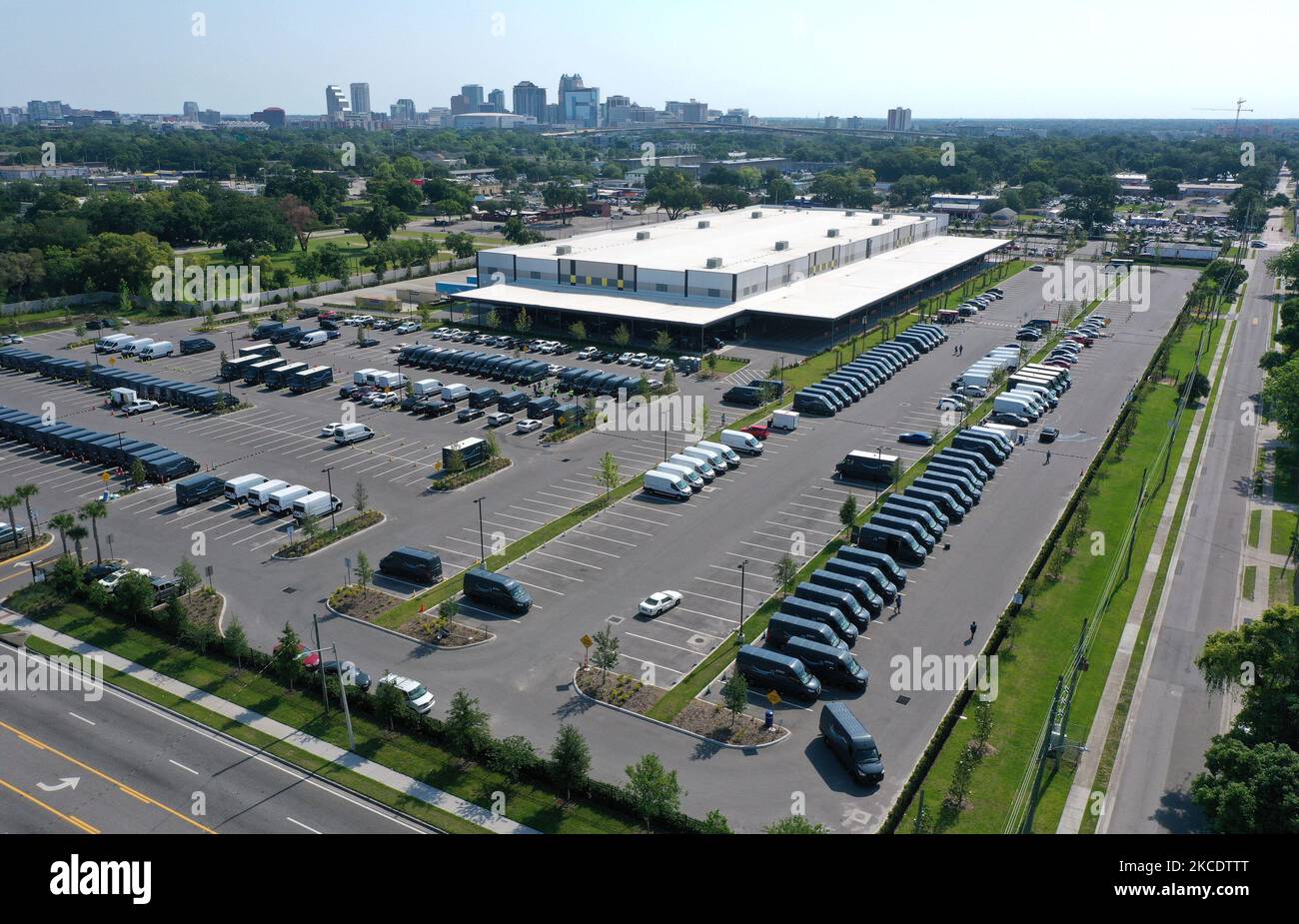 May 1, 2021 - Orlando, Florida, United States - In this aerial view from a drone, delivery vans are seen parked at an Amazon last-mile delivery facility on May 1, 2021 in Orlando, Florida. Amazon announced that it will hold it annual two-day Prime Day shopping event in its second quarter, rather than July, to boost spending in what is typically a slower time for retail sales. (Photo by Paul Hennessy/NurPhoto) Stock Photo