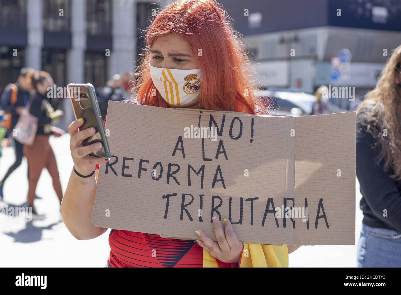Young people from the Colombian population of Spain demonstrate for the colonvia tax reform, which forces young people to pay more taxes in Colombia, at the Puerta del Sol in Madrid, Spain, on May 2, 2021. (Photo by Oscar Gonzalez/NurPhoto) Stock Photo
