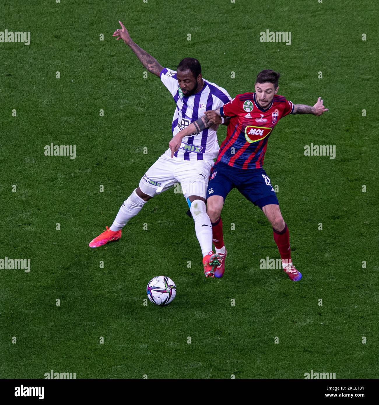 Petrus Boumal of Ujpest FC competes for the ball with Jose Marcos